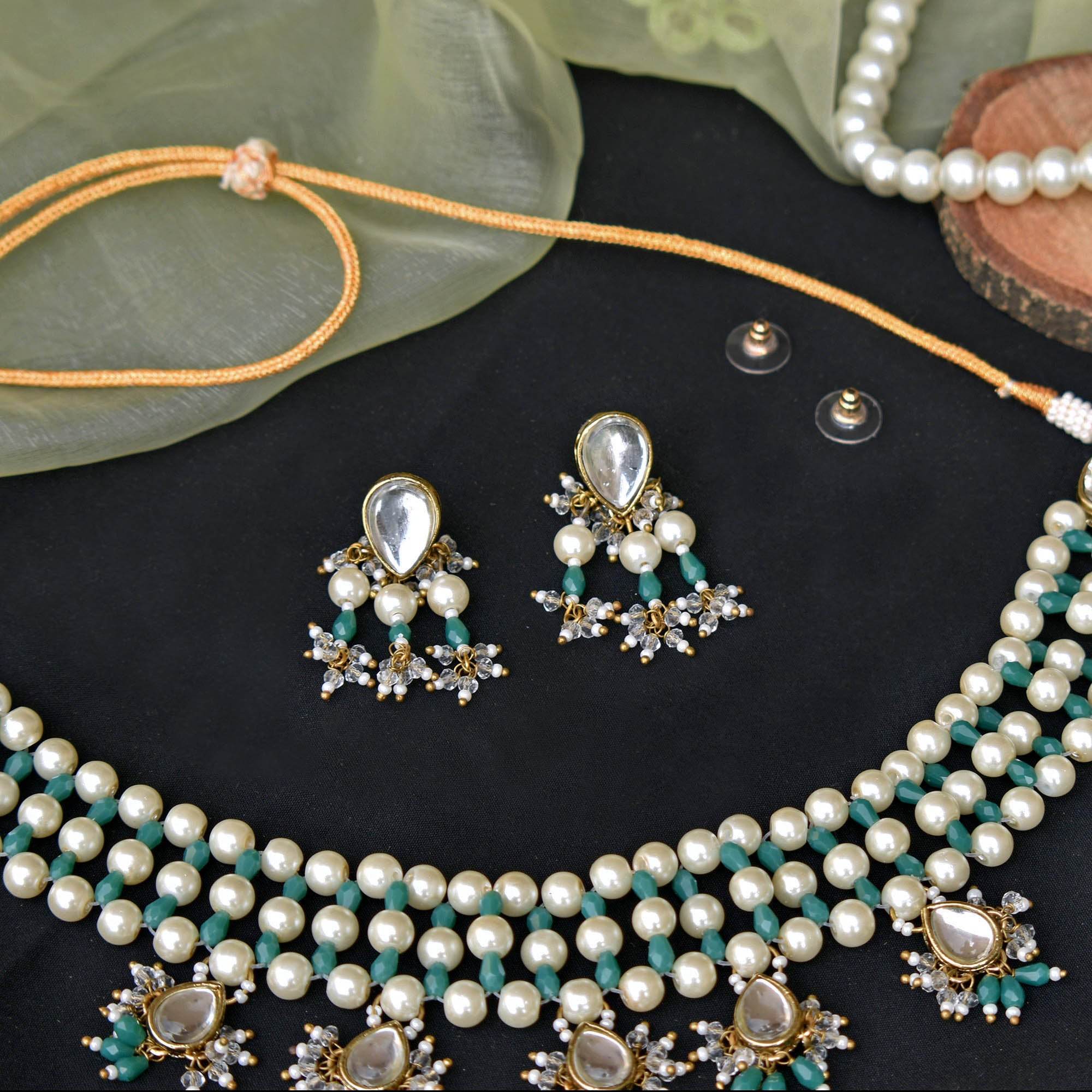 Kundan choker set in gold-tone with matching earrings and long bridal necklace, perfect for wedding functions , festive and bridal wear