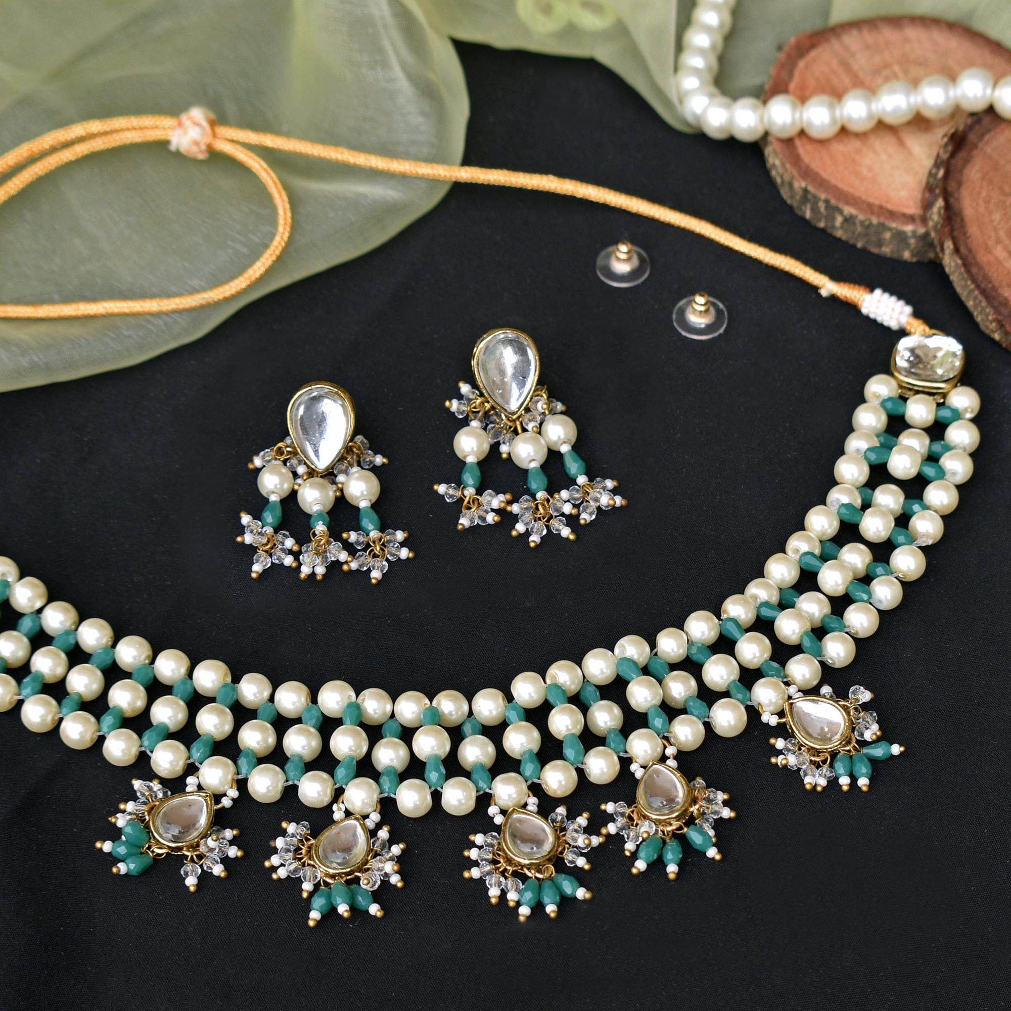 Kundan choker set in gold-tone with matching earrings and long bridal necklace, perfect for wedding functions , festive and bridal wear