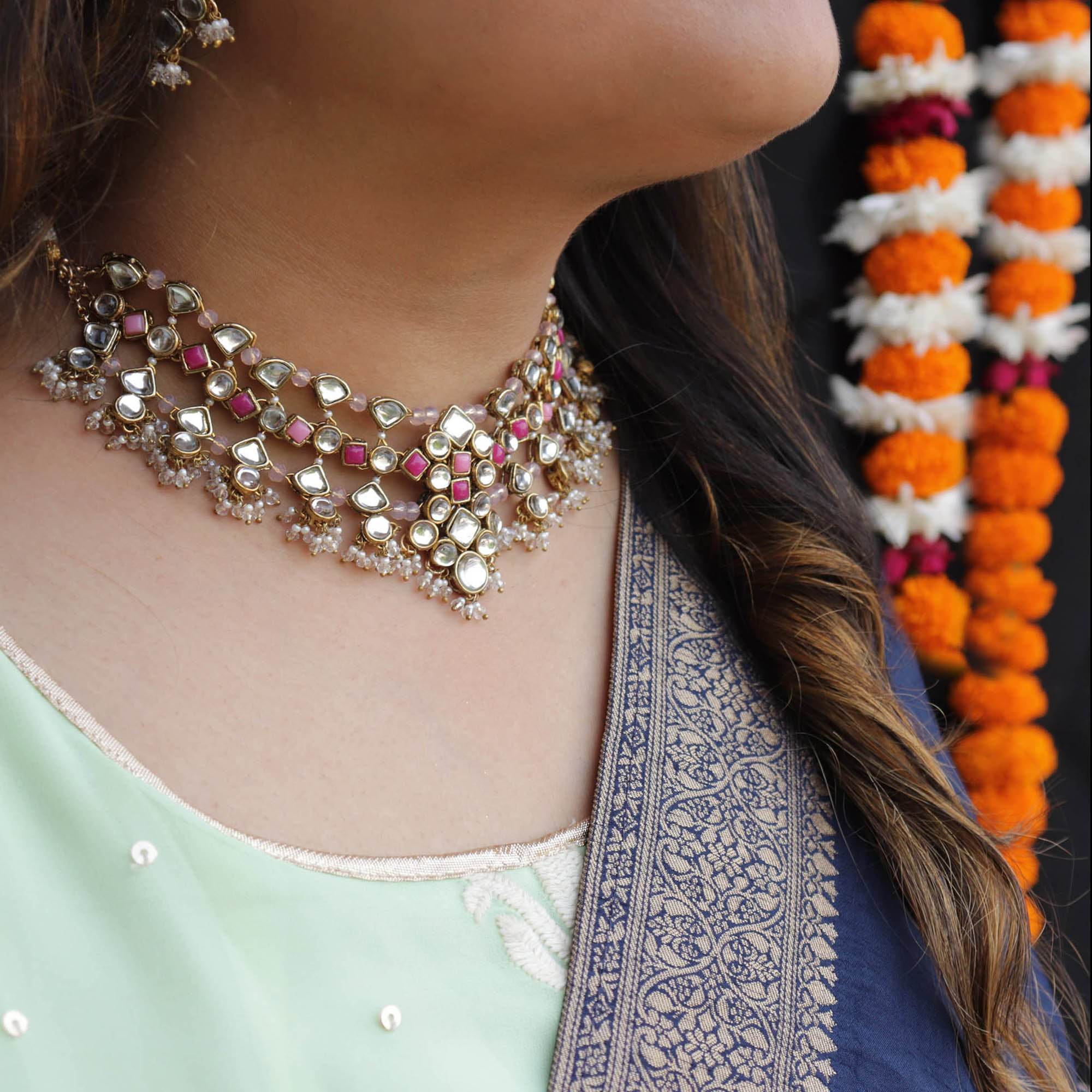 Kundan choker set in gold-tone with matching earrings and long bridal necklace, perfect for wedding functions , festive and bridal wear
