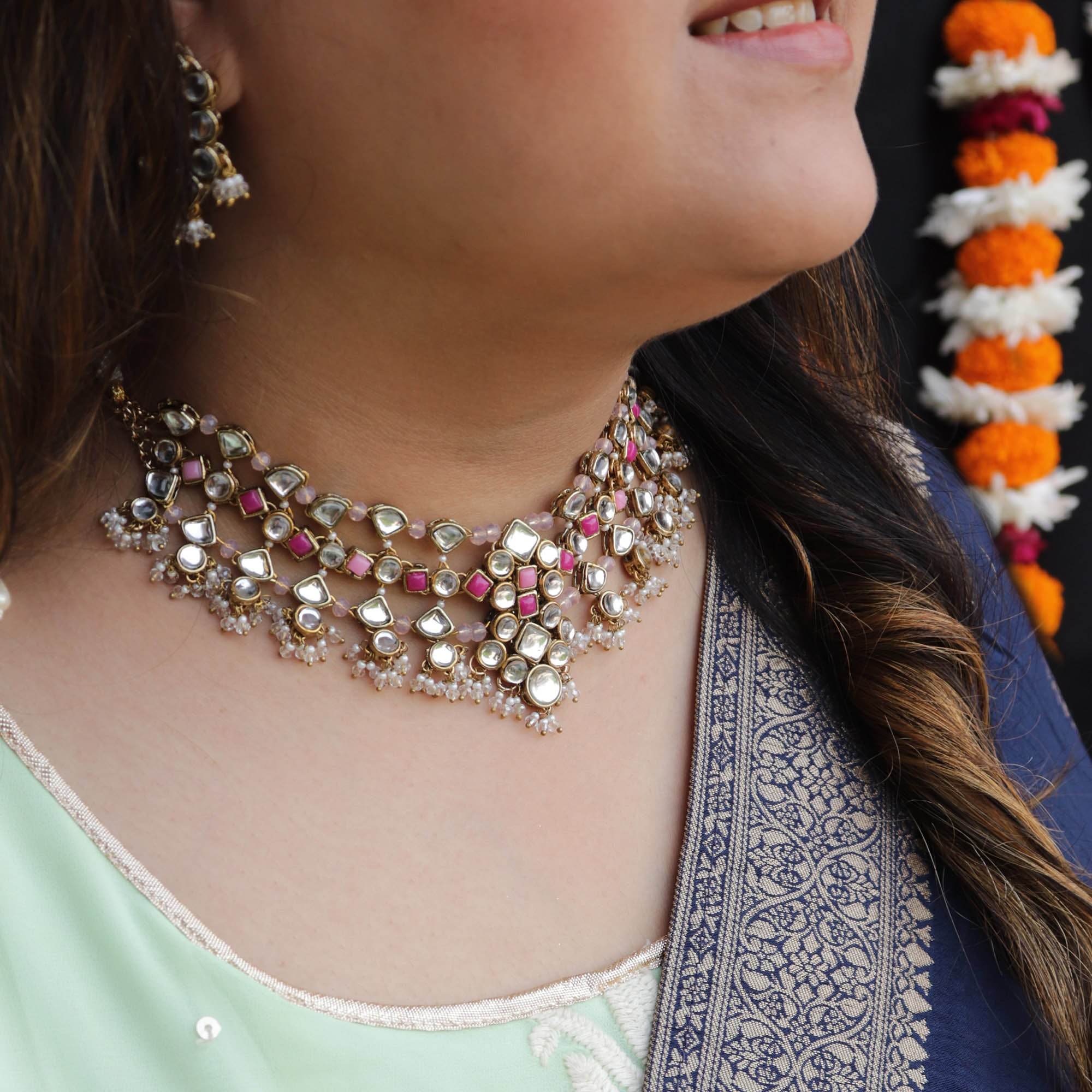 Kundan choker set in gold-tone with matching earrings and long bridal necklace, perfect for wedding functions , festive and bridal wear