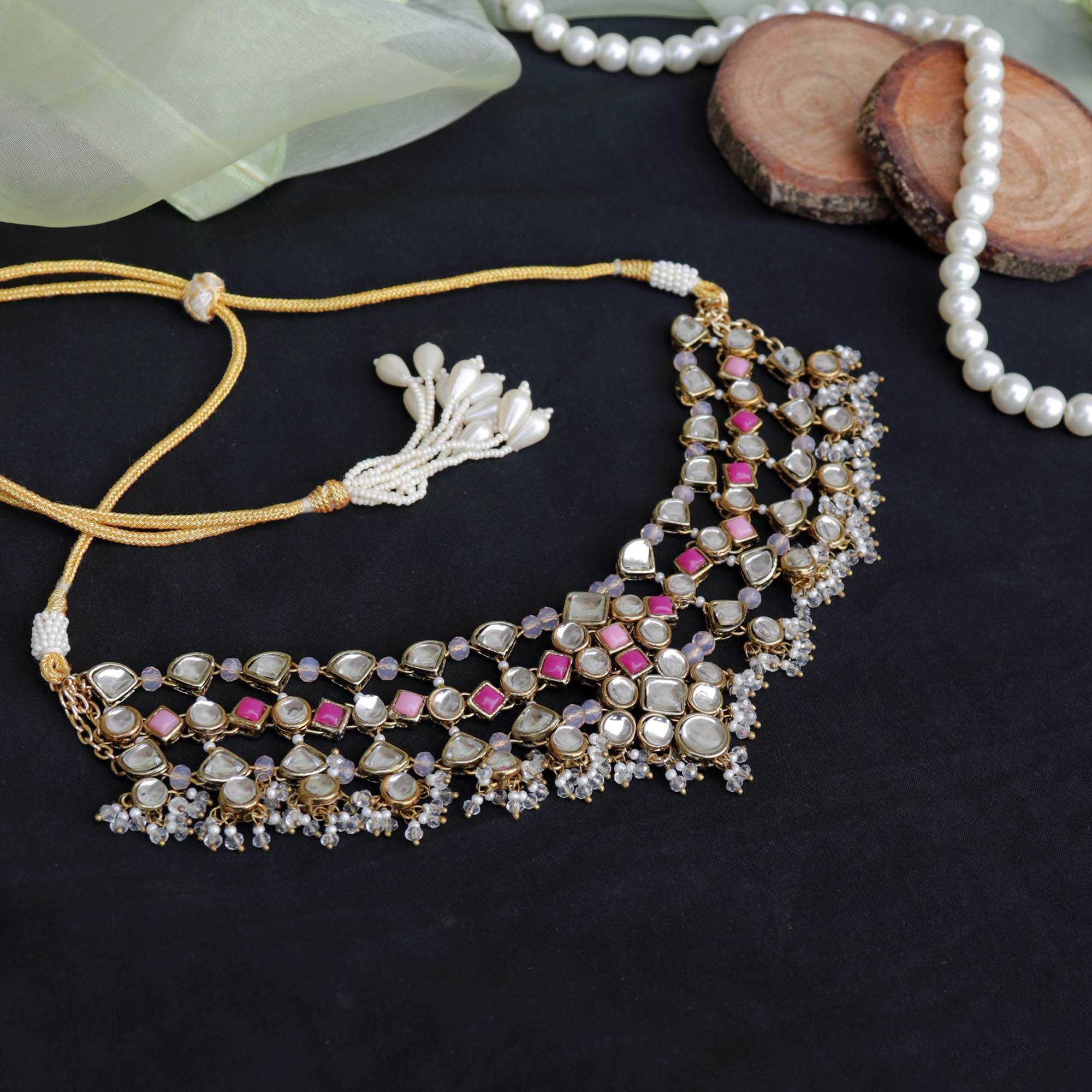 Kundan choker set in gold-tone with matching earrings and long bridal necklace, perfect for wedding functions , festive and bridal wear
