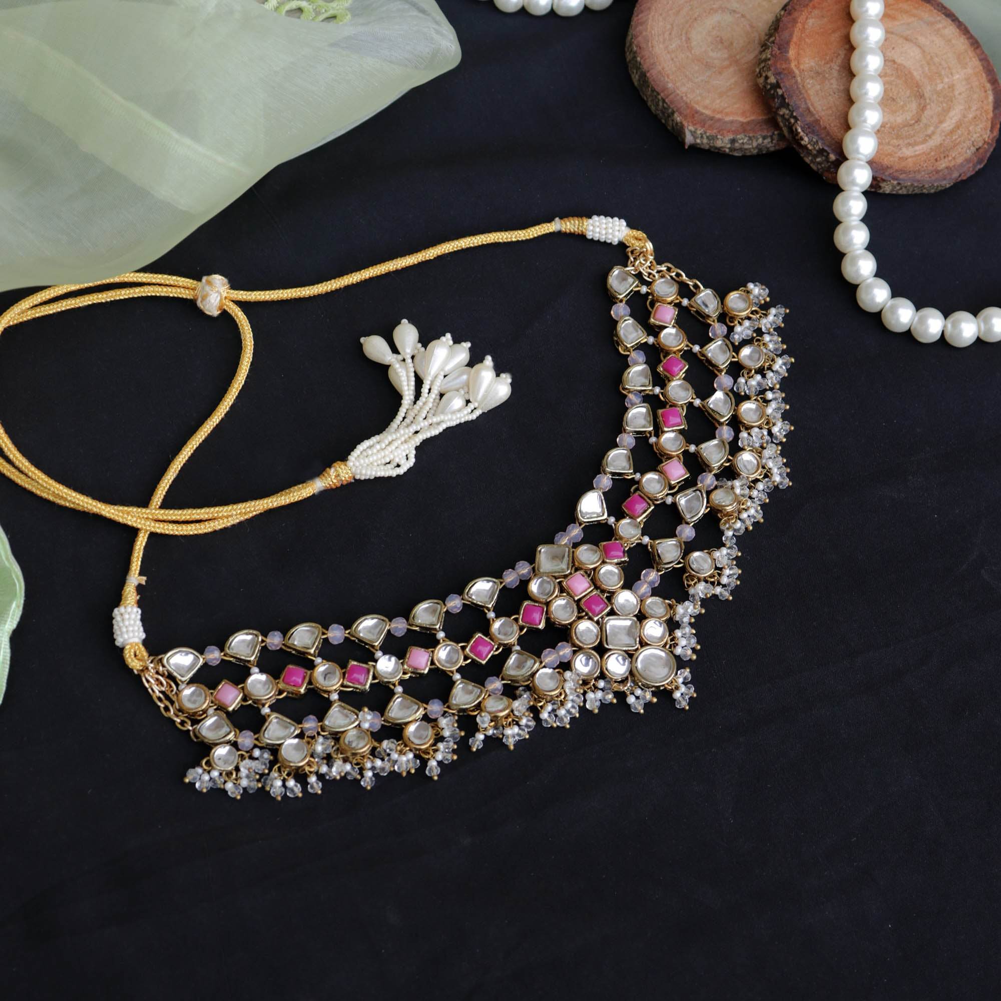 Kundan choker set in gold-tone with matching earrings and long bridal necklace, perfect for wedding functions , festive and bridal wear