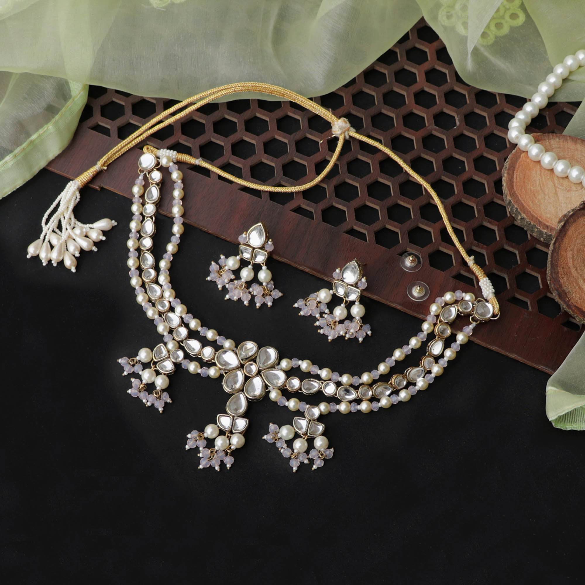 Kundan choker set in gold-tone with matching earrings and long bridal necklace, perfect for wedding functions , festive and bridal wear