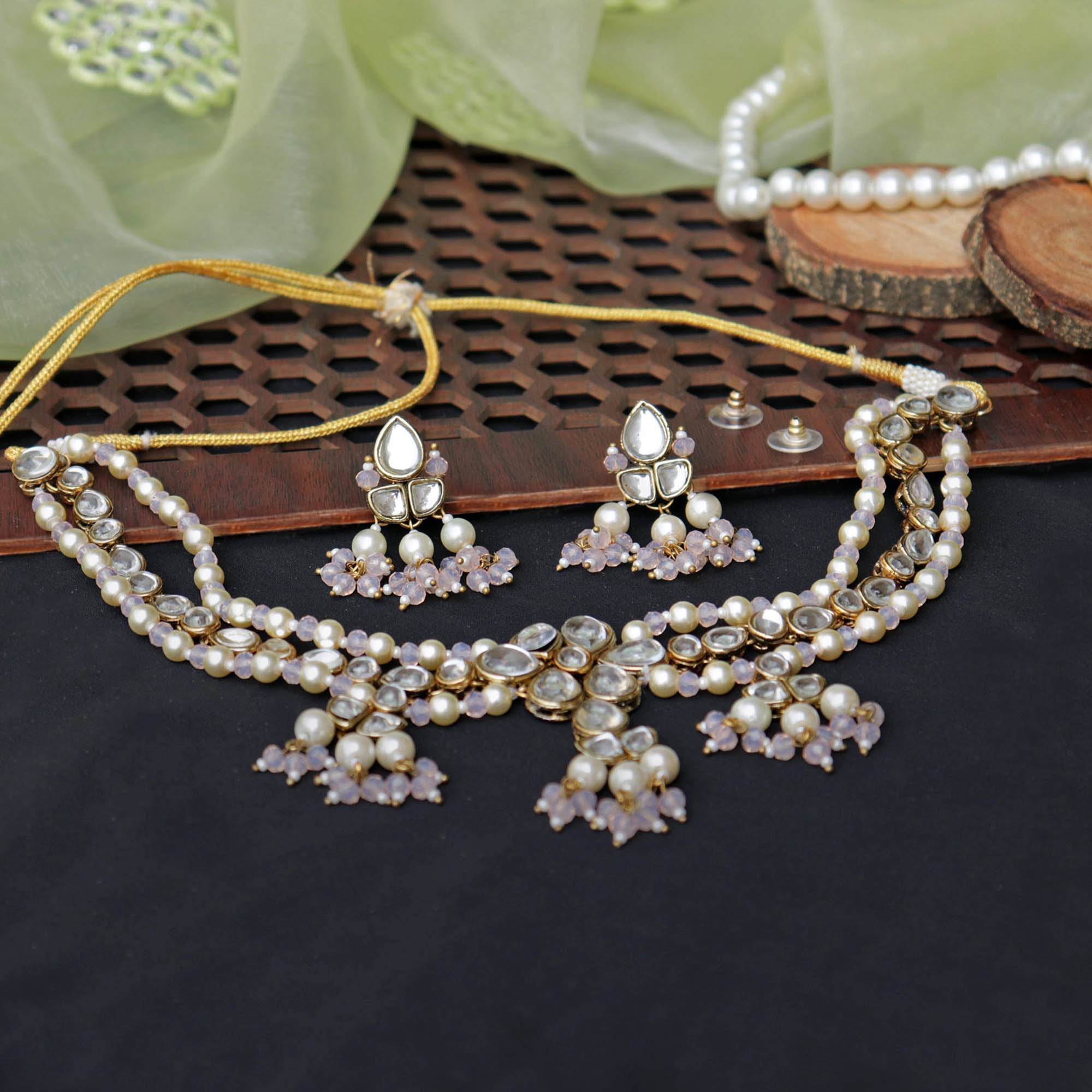 Kundan choker set in gold-tone with matching earrings and long bridal necklace, perfect for wedding functions , festive and bridal wear