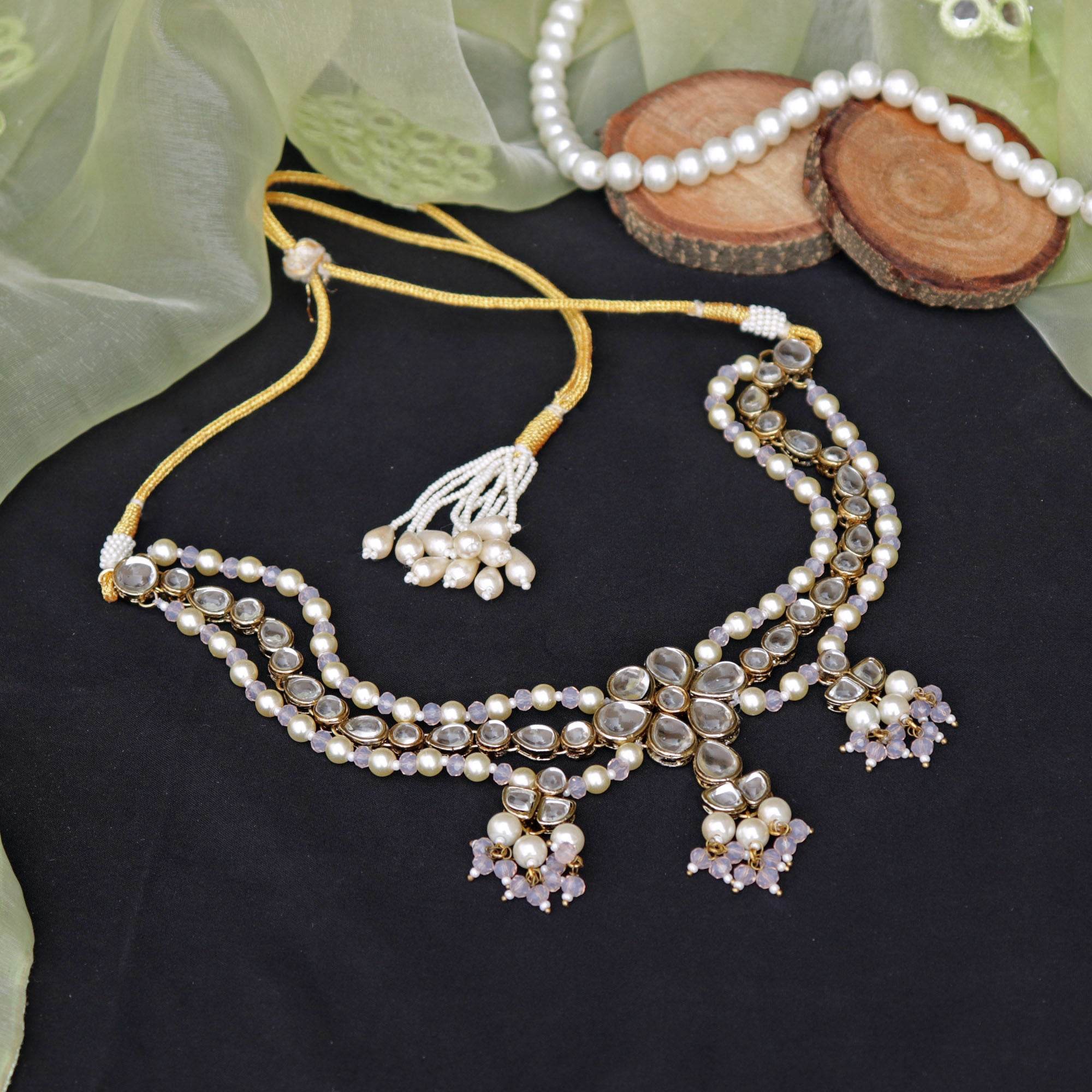 Kundan choker set in gold-tone with matching earrings and long bridal necklace, perfect for wedding functions , festive and bridal wear