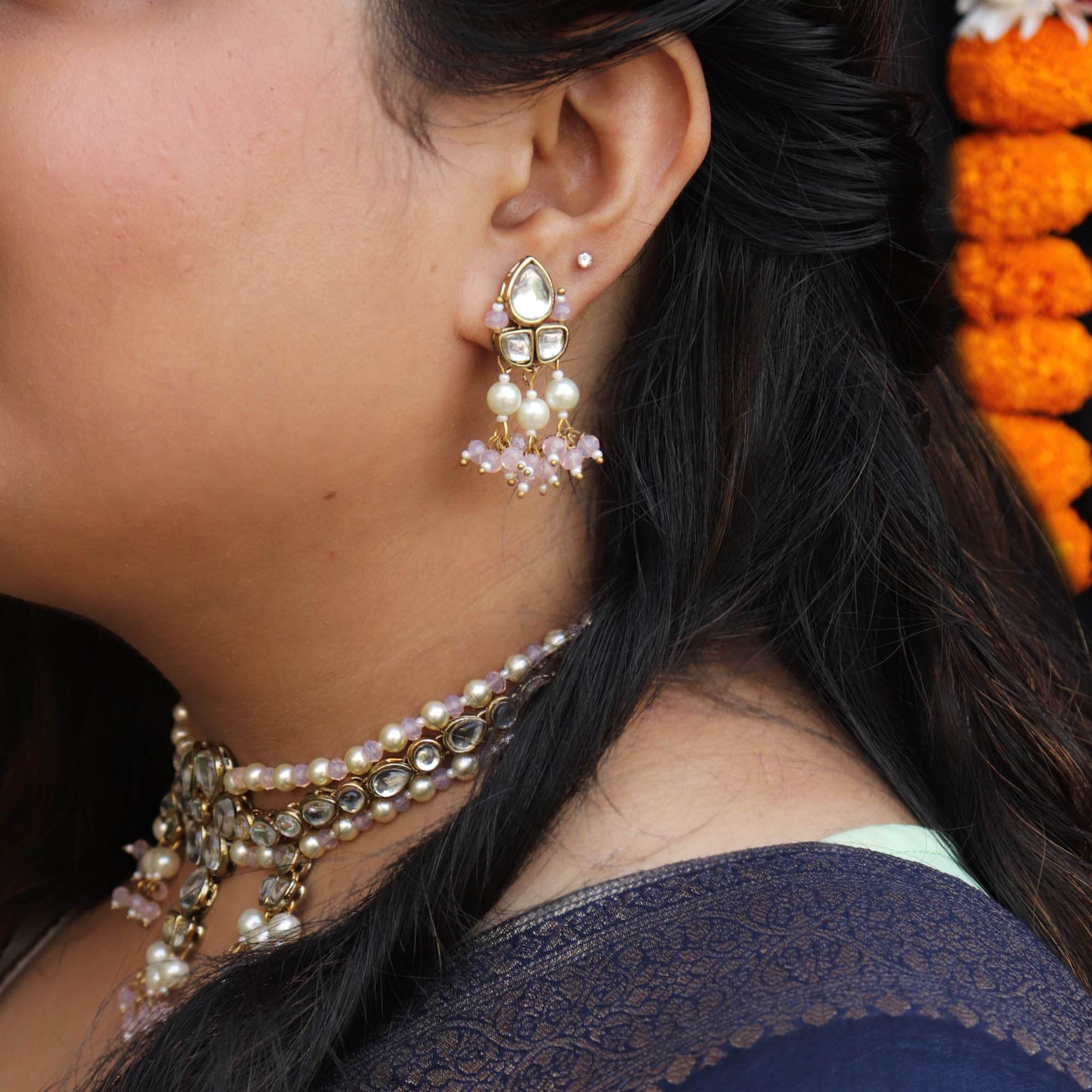 Kundan choker set in gold-tone with matching earrings and long bridal necklace, perfect for wedding functions , festive and bridal wear