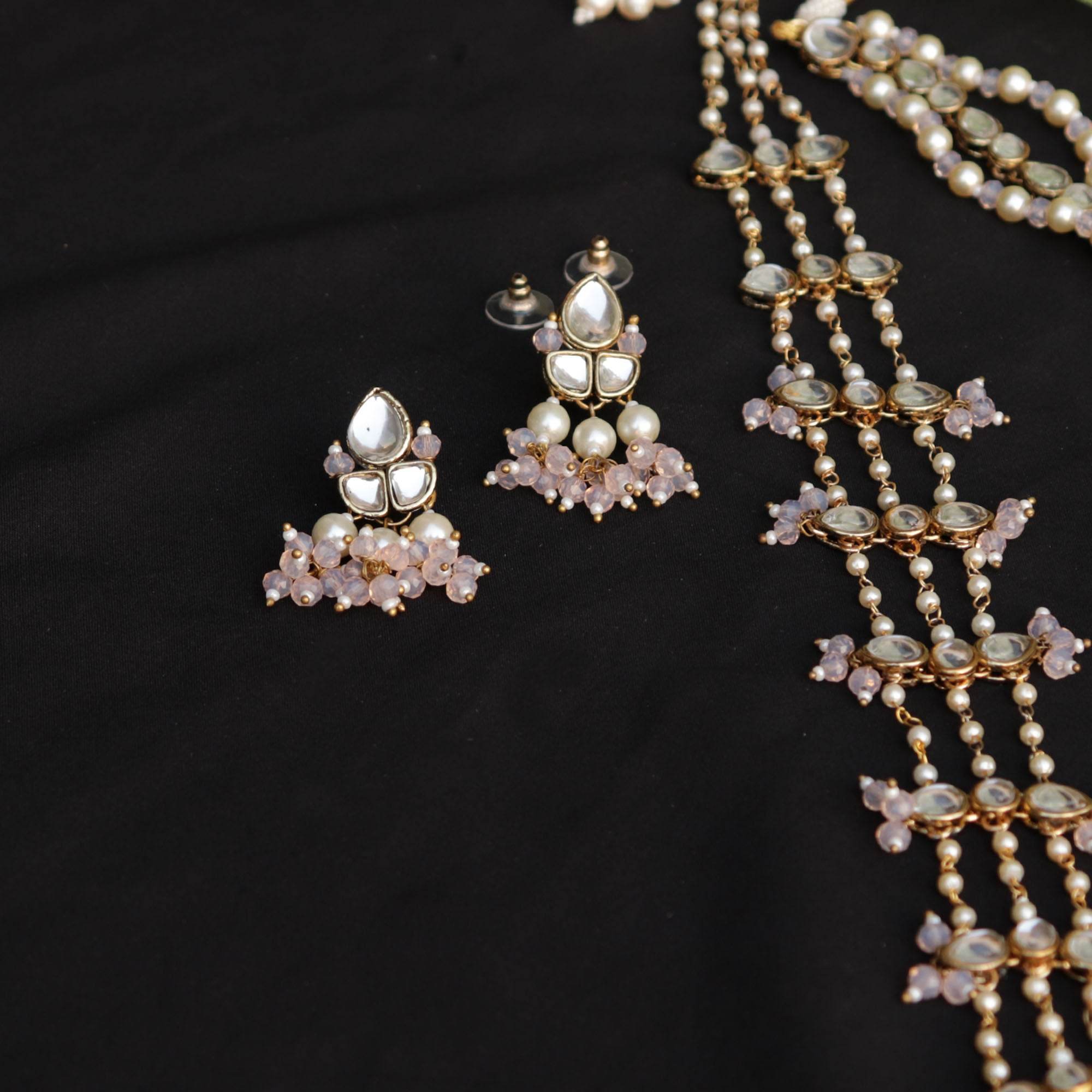 Kundan choker set in gold-tone with matching earrings and long bridal necklace, perfect for wedding functions , festive and bridal wear