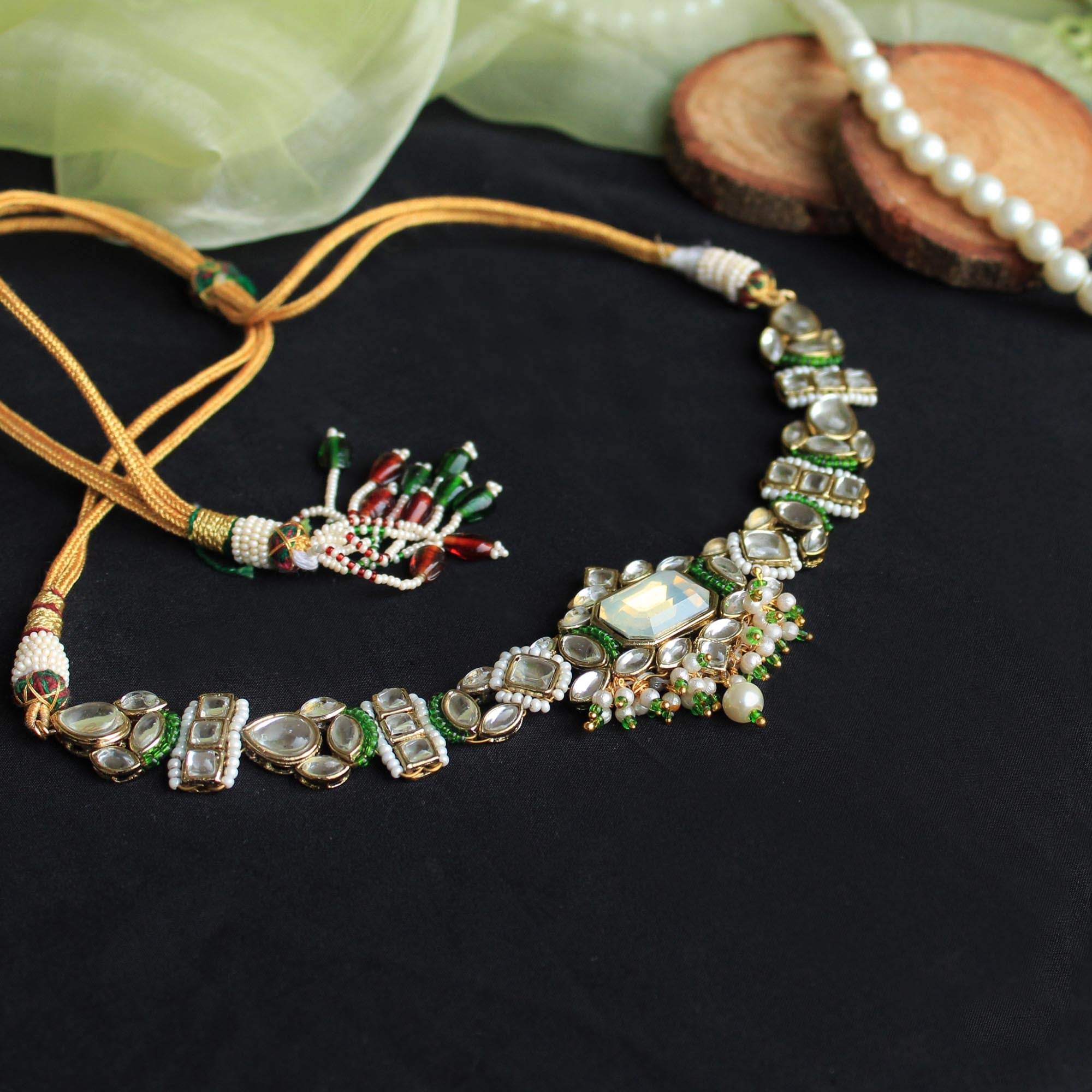 Kundan choker set in gold-tone with matching earrings and long bridal necklace, perfect for wedding functions , festive and bridal wear