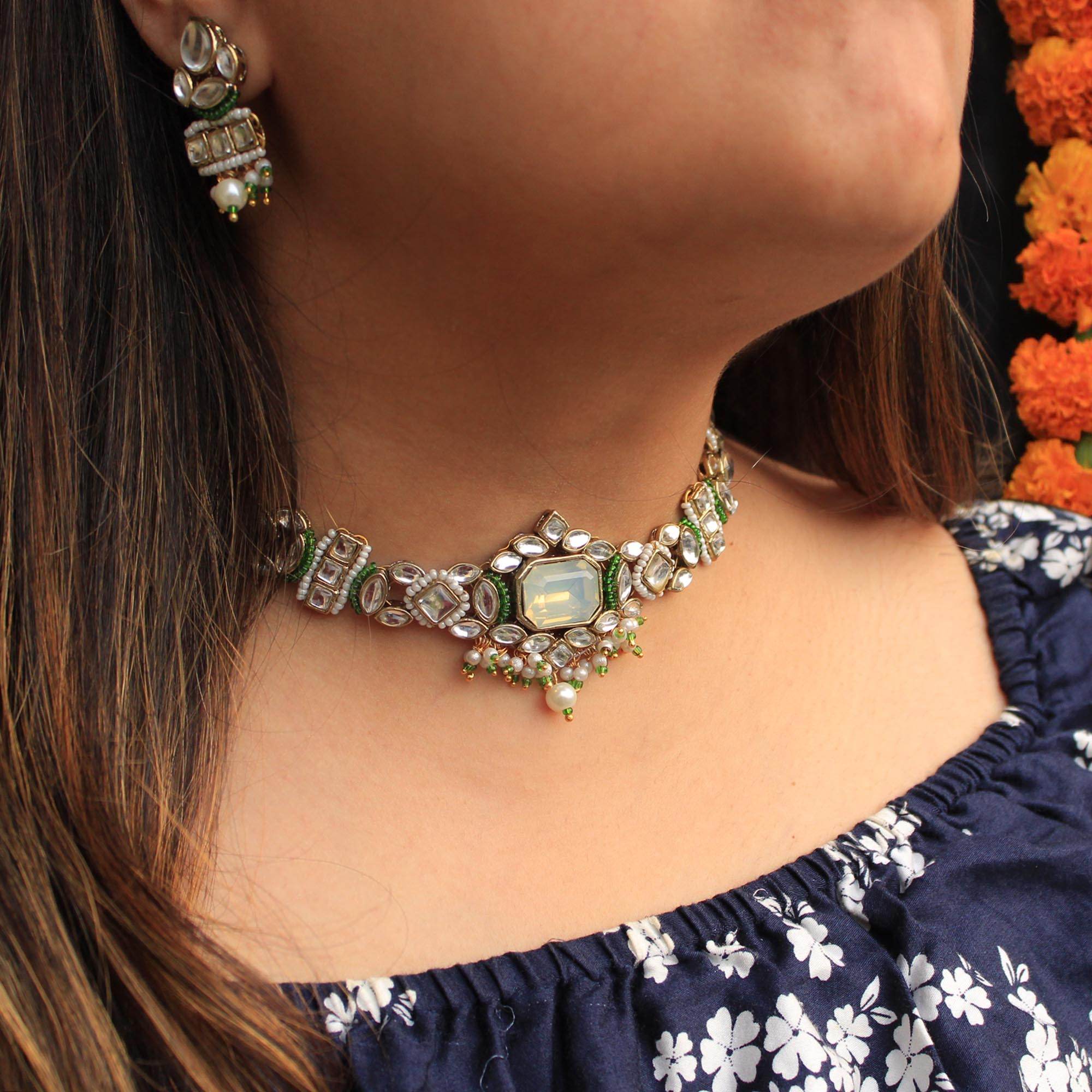 Kundan choker set in gold-tone with matching earrings and long bridal necklace, perfect for wedding functions , festive and bridal wear