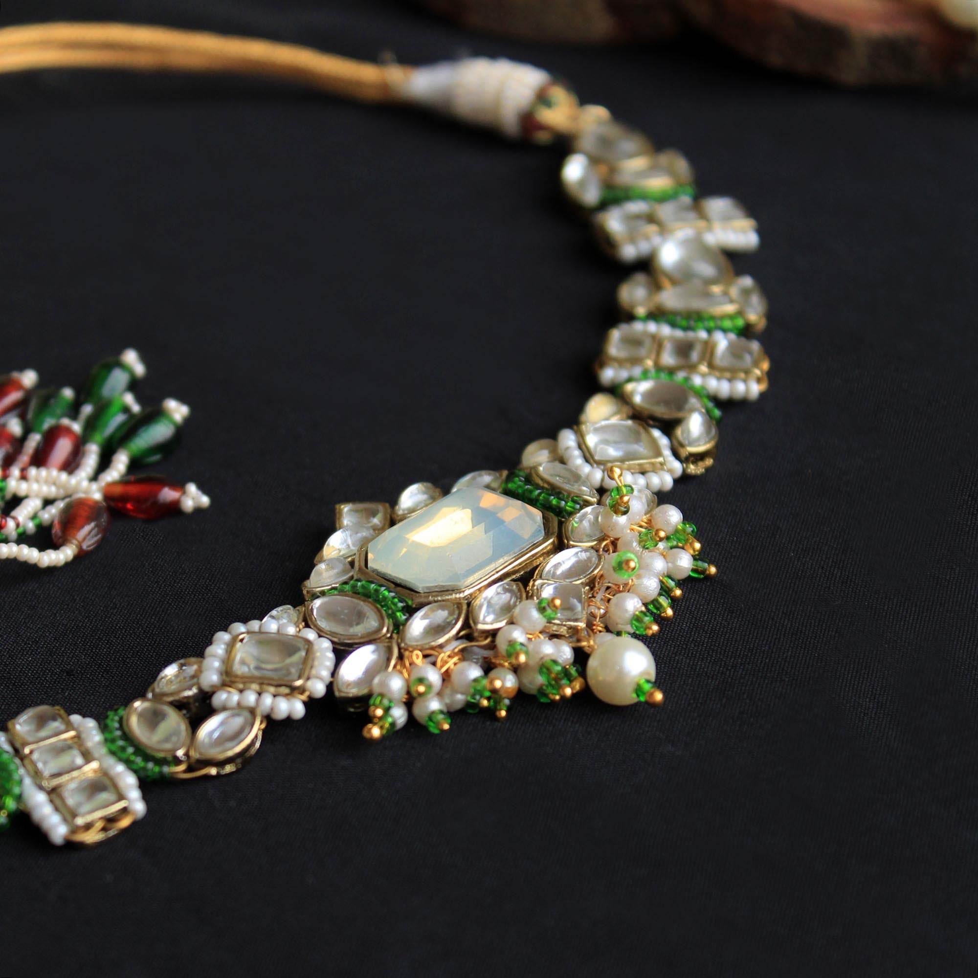 Kundan choker set in gold-tone with matching earrings and long bridal necklace, perfect for wedding functions , festive and bridal wear