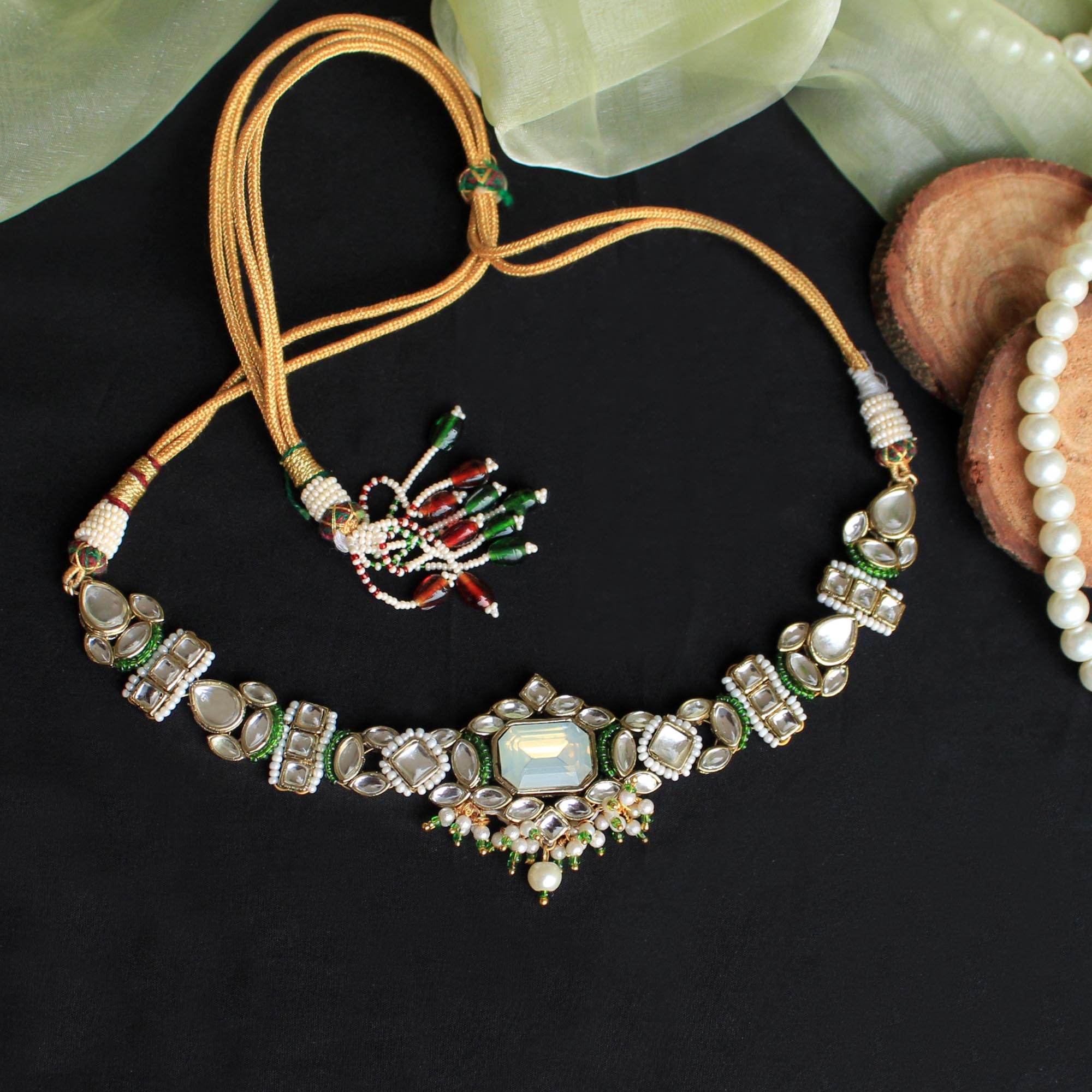 Kundan choker set in gold-tone with matching earrings and long bridal necklace, perfect for wedding functions , festive and bridal wear