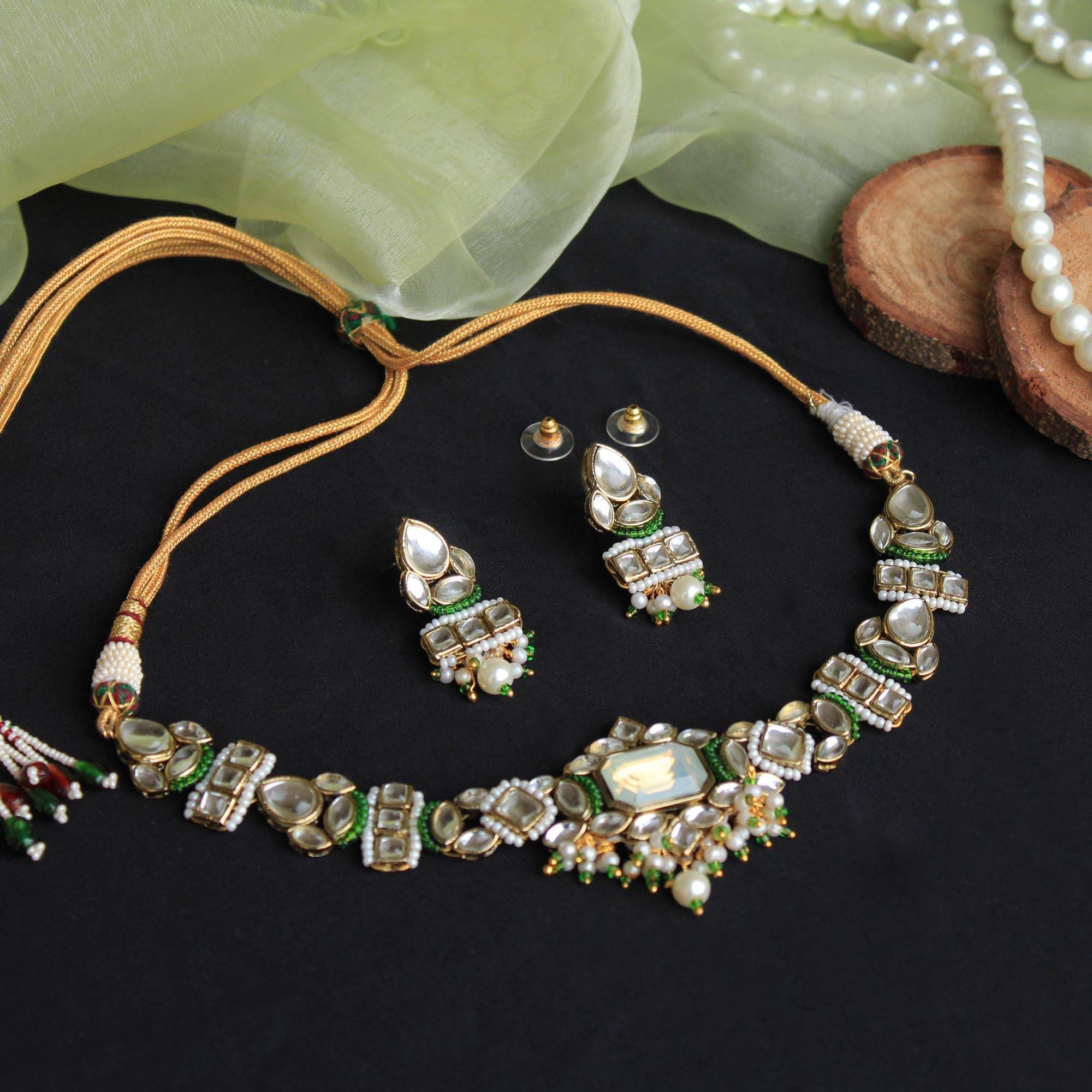 Kundan choker set in gold-tone with matching earrings and long bridal necklace, perfect for wedding functions , festive and bridal wear