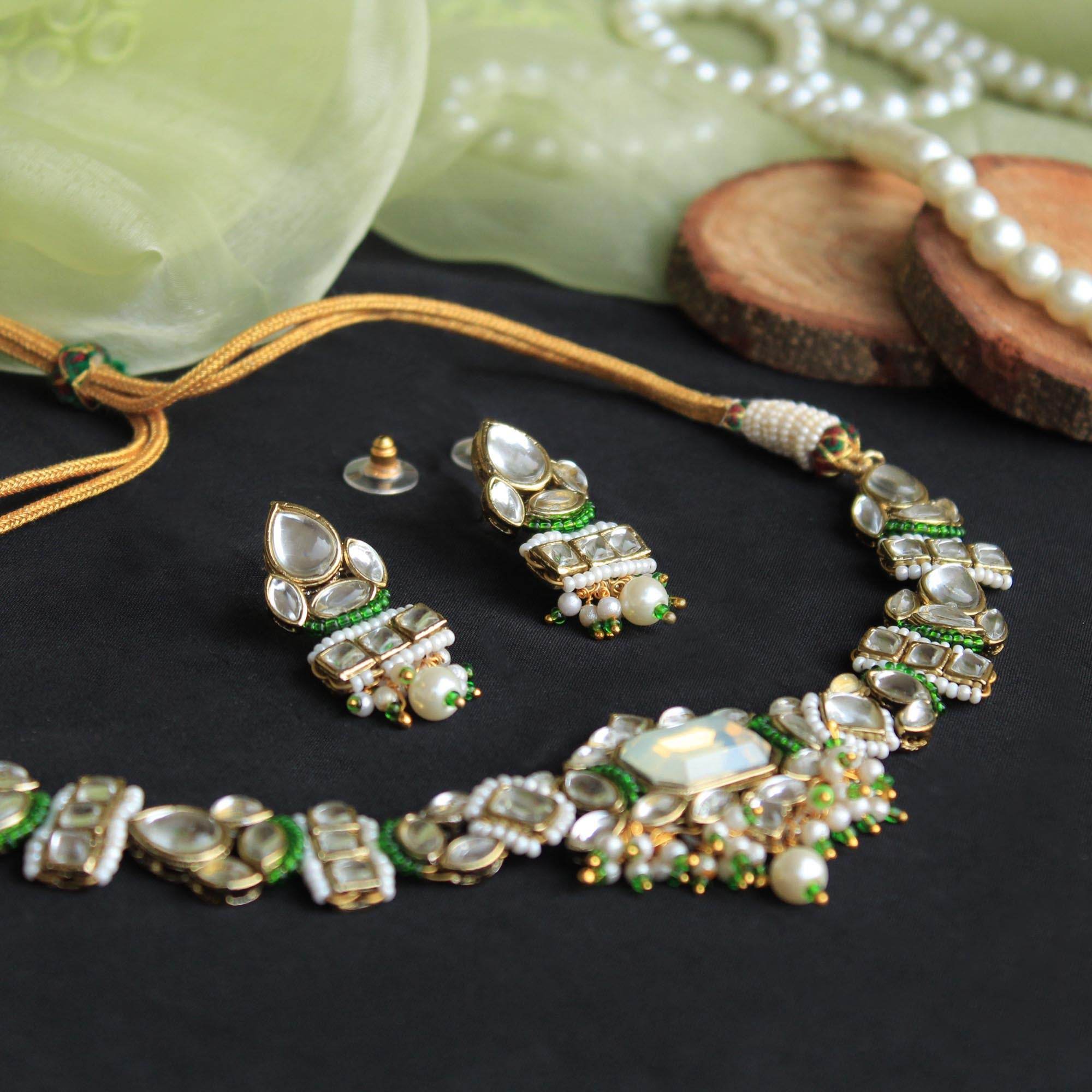 Kundan choker set in gold-tone with matching earrings and long bridal necklace, perfect for wedding functions , festive and bridal wear