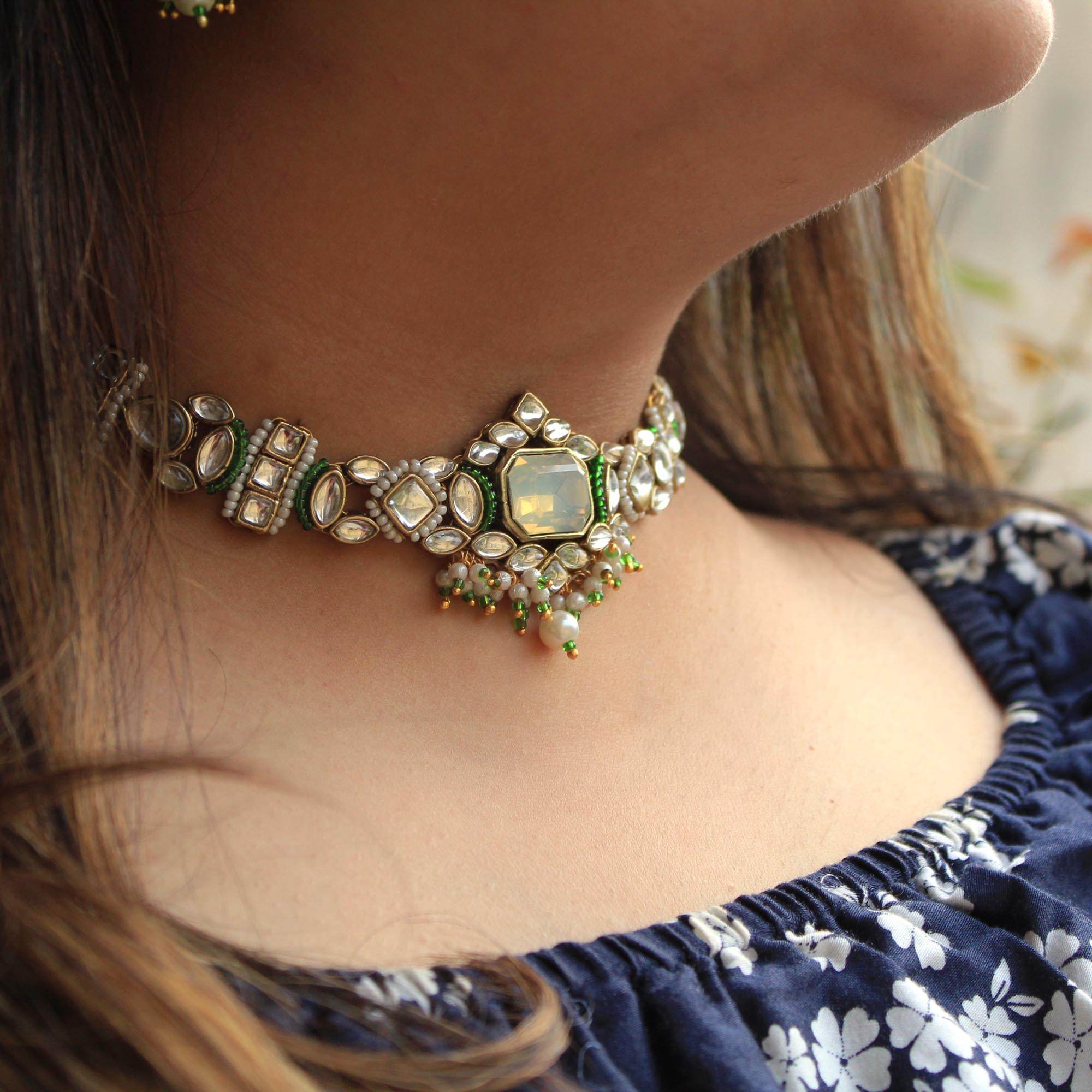 Kundan choker set in gold-tone with matching earrings and long bridal necklace, perfect for wedding functions , festive and bridal wear