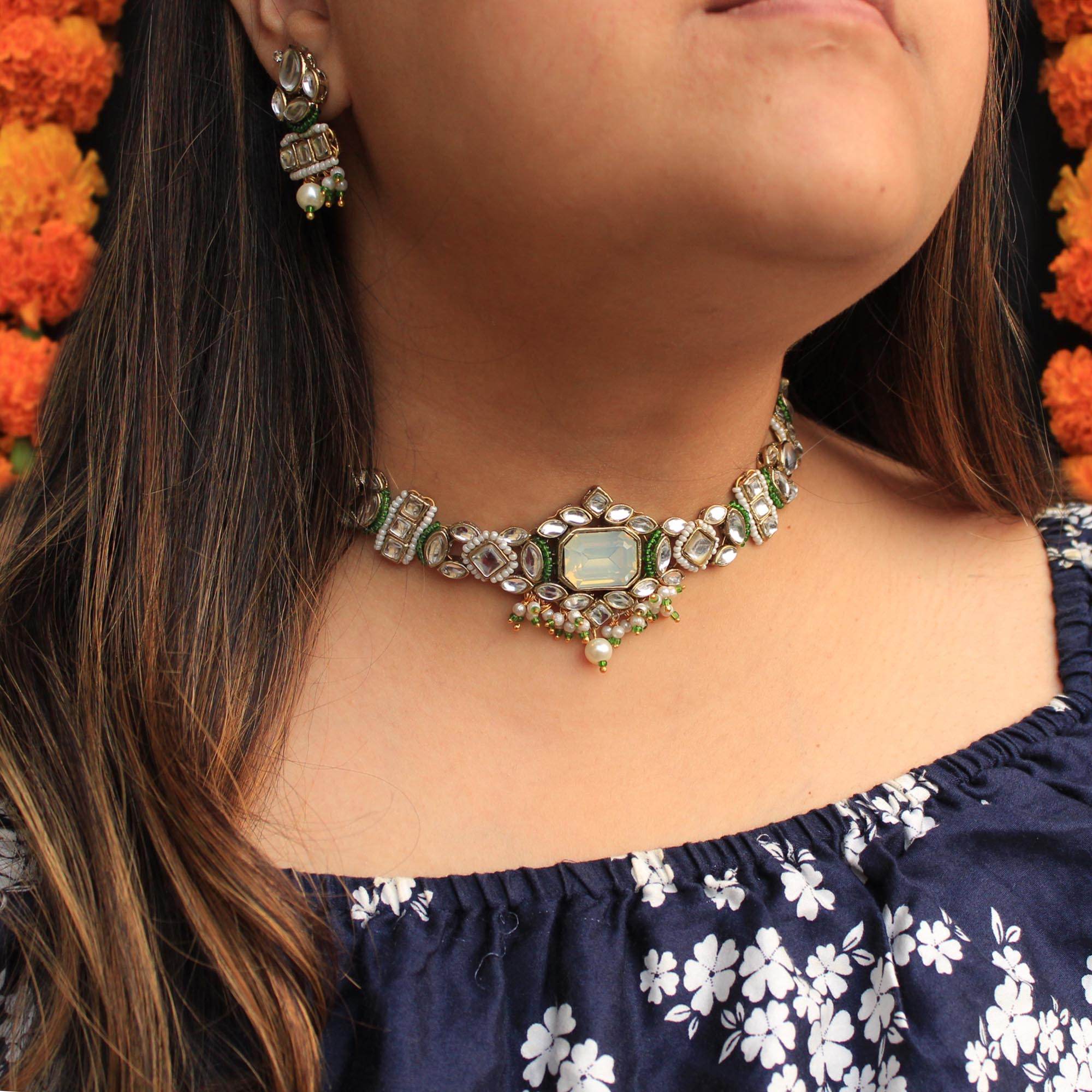 Kundan choker set in gold-tone with matching earrings and long bridal necklace, perfect for wedding functions , festive and bridal wear