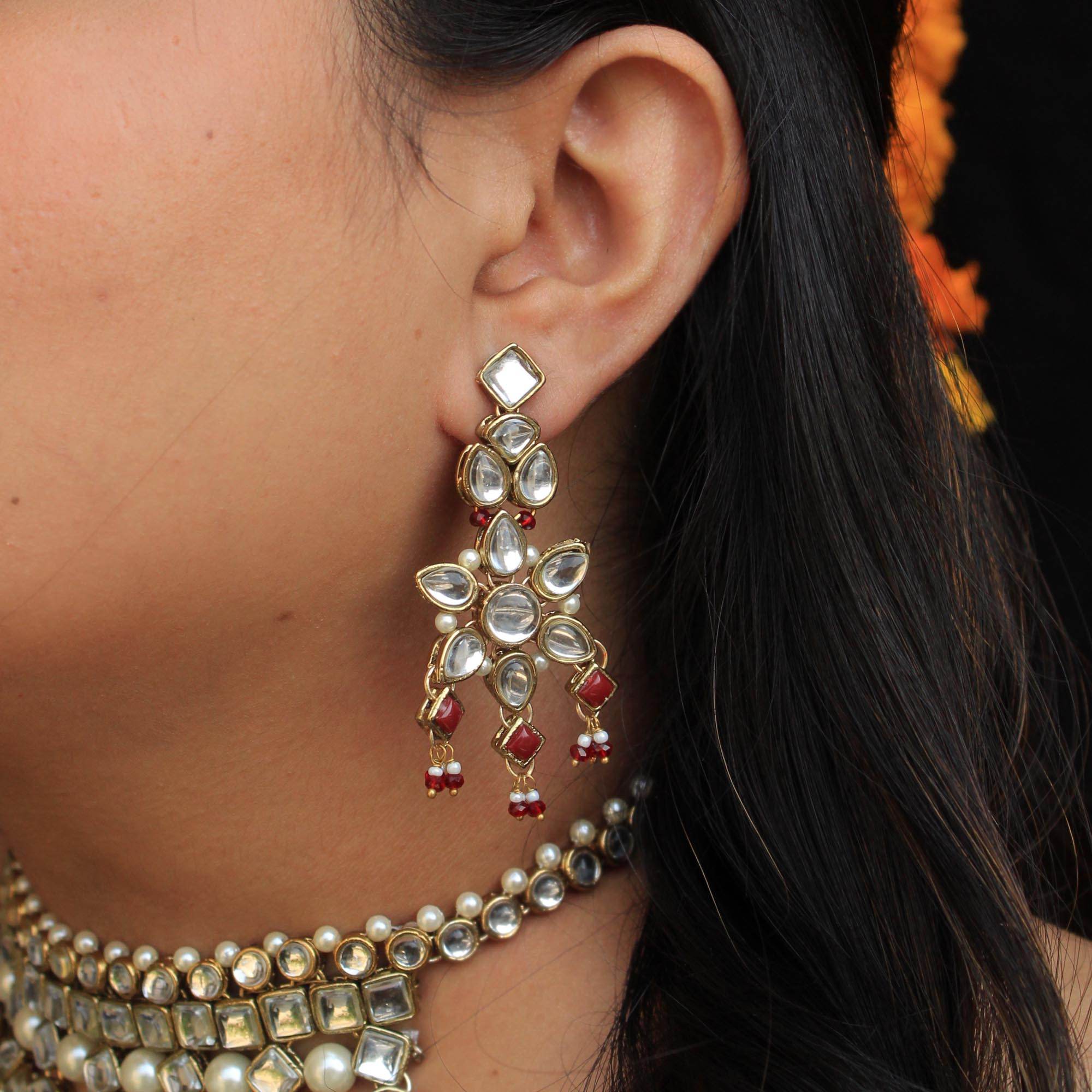 Kundan choker set in gold-tone with matching earrings and long bridal necklace, perfect for wedding functions , festive and bridal wear