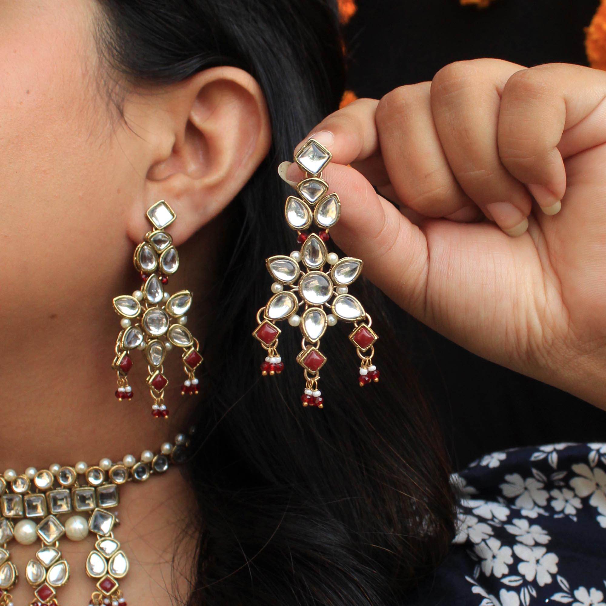 Kundan choker set in gold-tone with matching earrings and long bridal necklace, perfect for wedding functions , festive and bridal wear