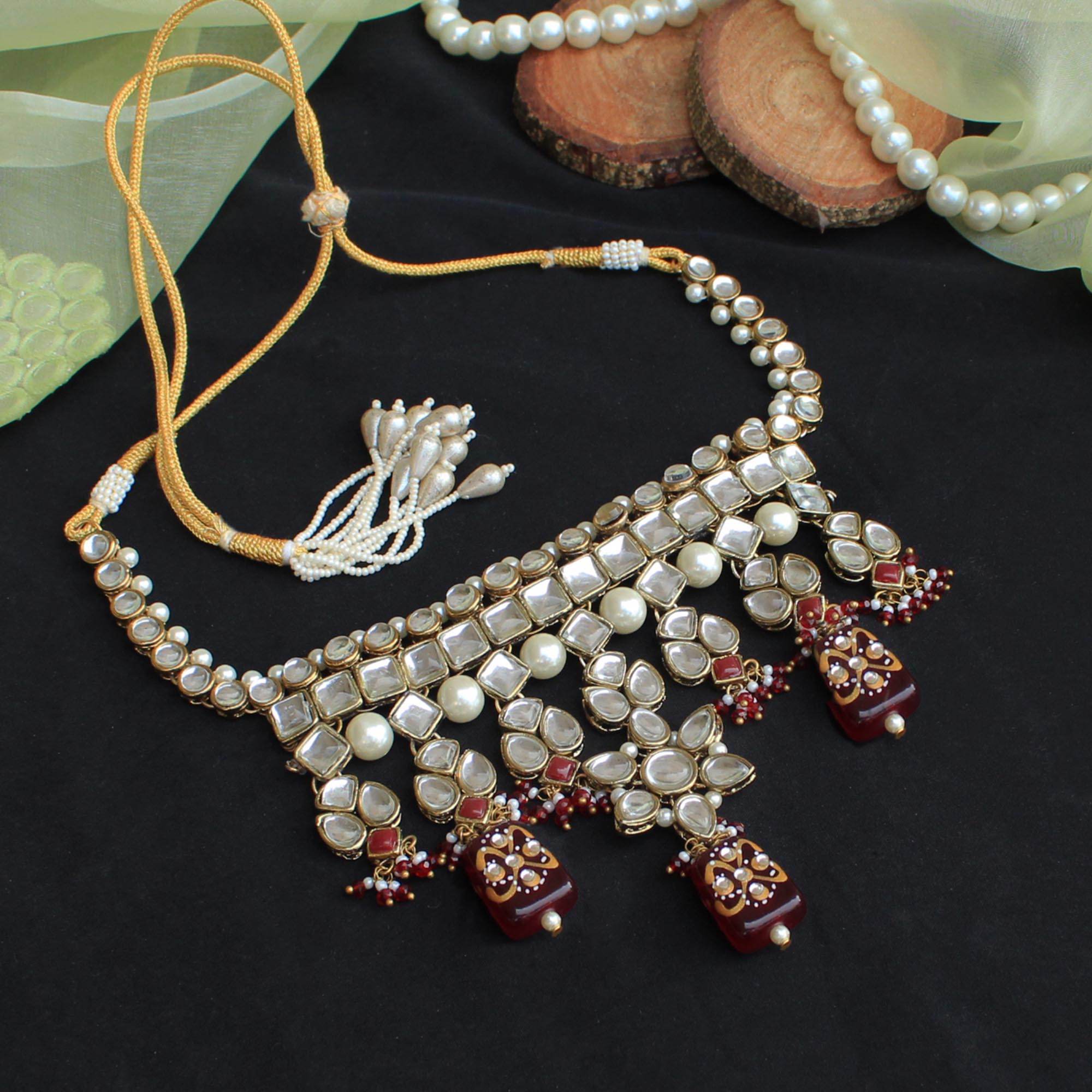 Kundan choker set in gold-tone with matching earrings and long bridal necklace, perfect for wedding functions , festive and bridal wear