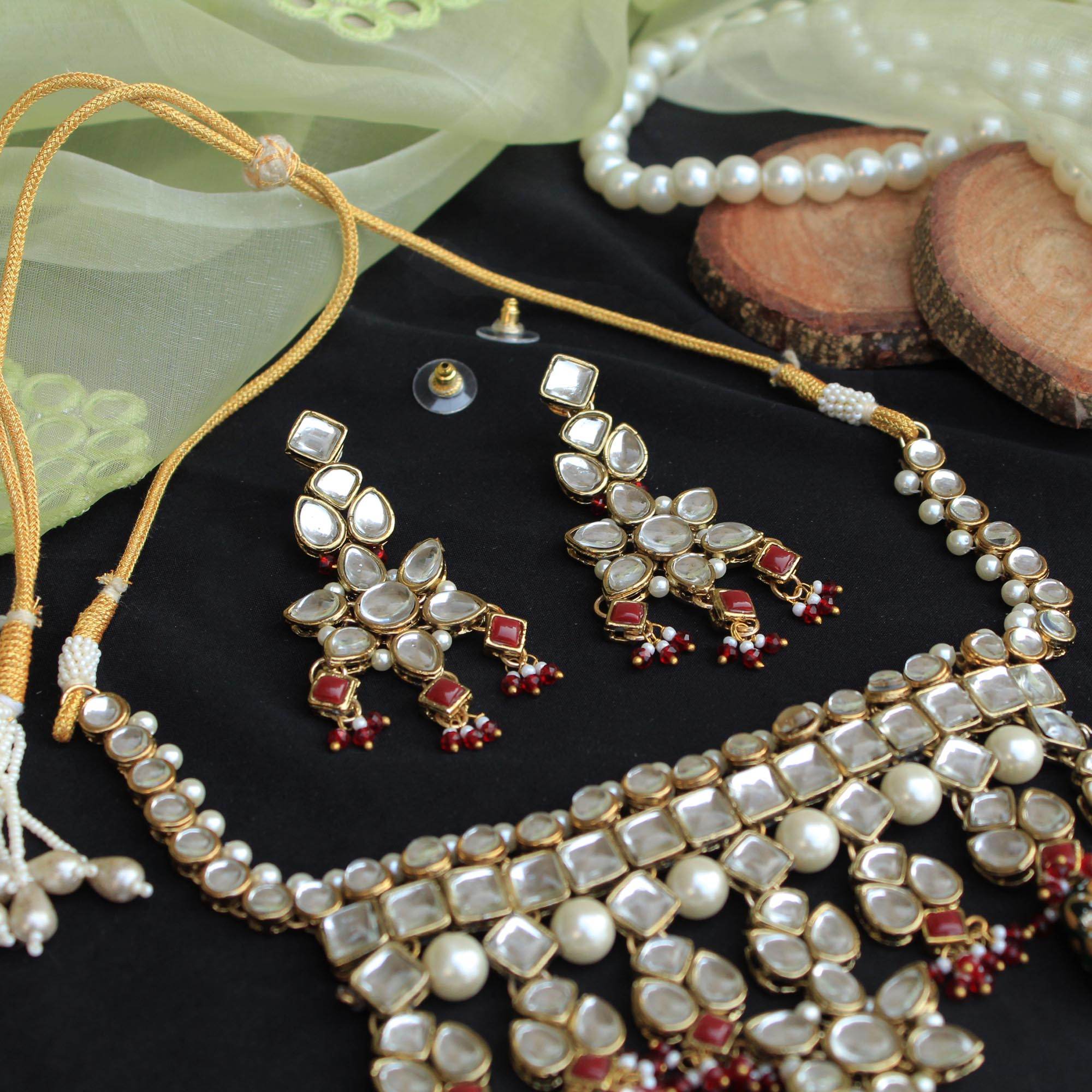 Kundan choker set in gold-tone with matching earrings and long bridal necklace, perfect for wedding functions , festive and bridal wear