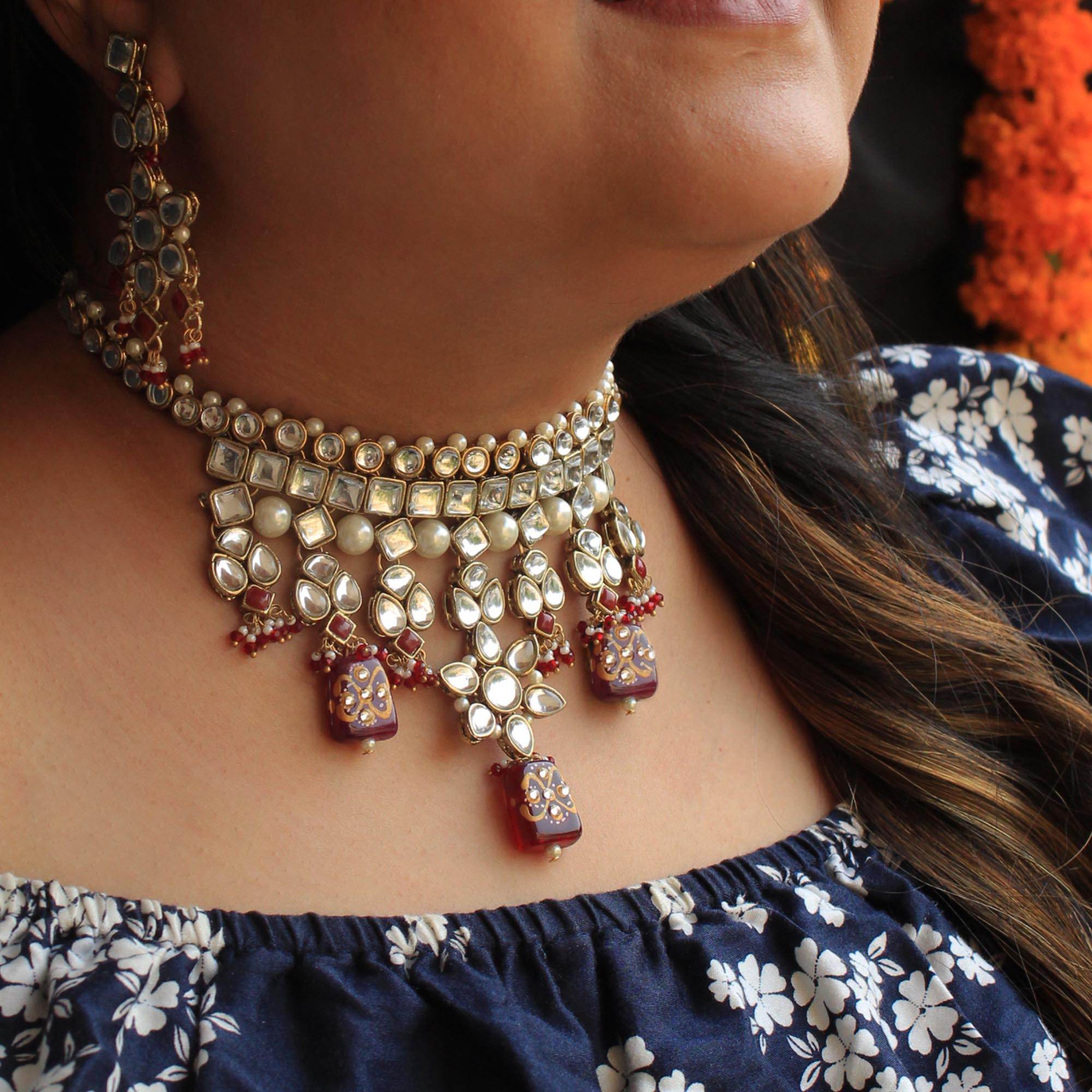 Kundan choker set in gold-tone with matching earrings and long bridal necklace, perfect for wedding functions , festive and bridal wear