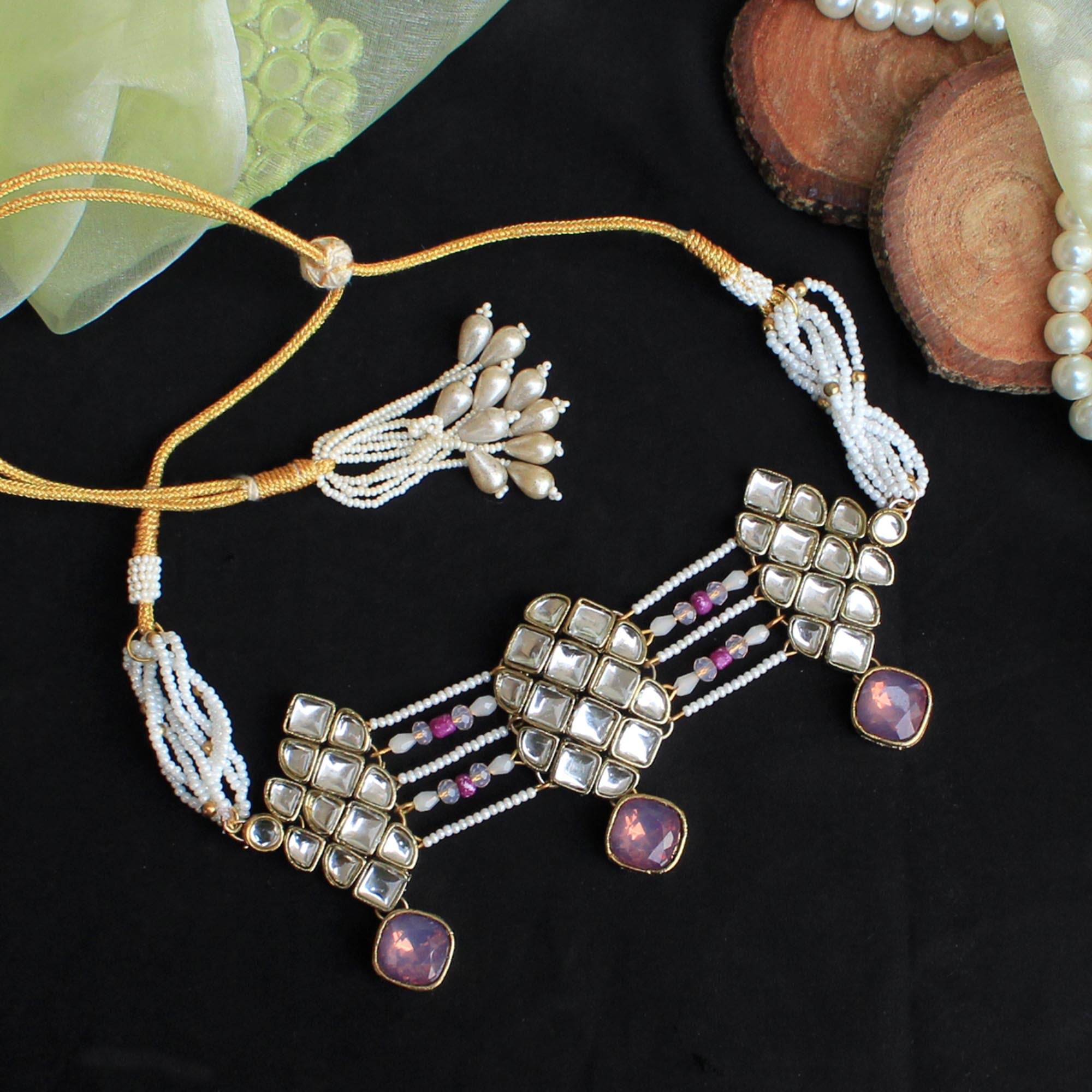 Kundan choker set in gold-tone with matching earrings and long bridal necklace, perfect for wedding functions , festive and bridal wear
