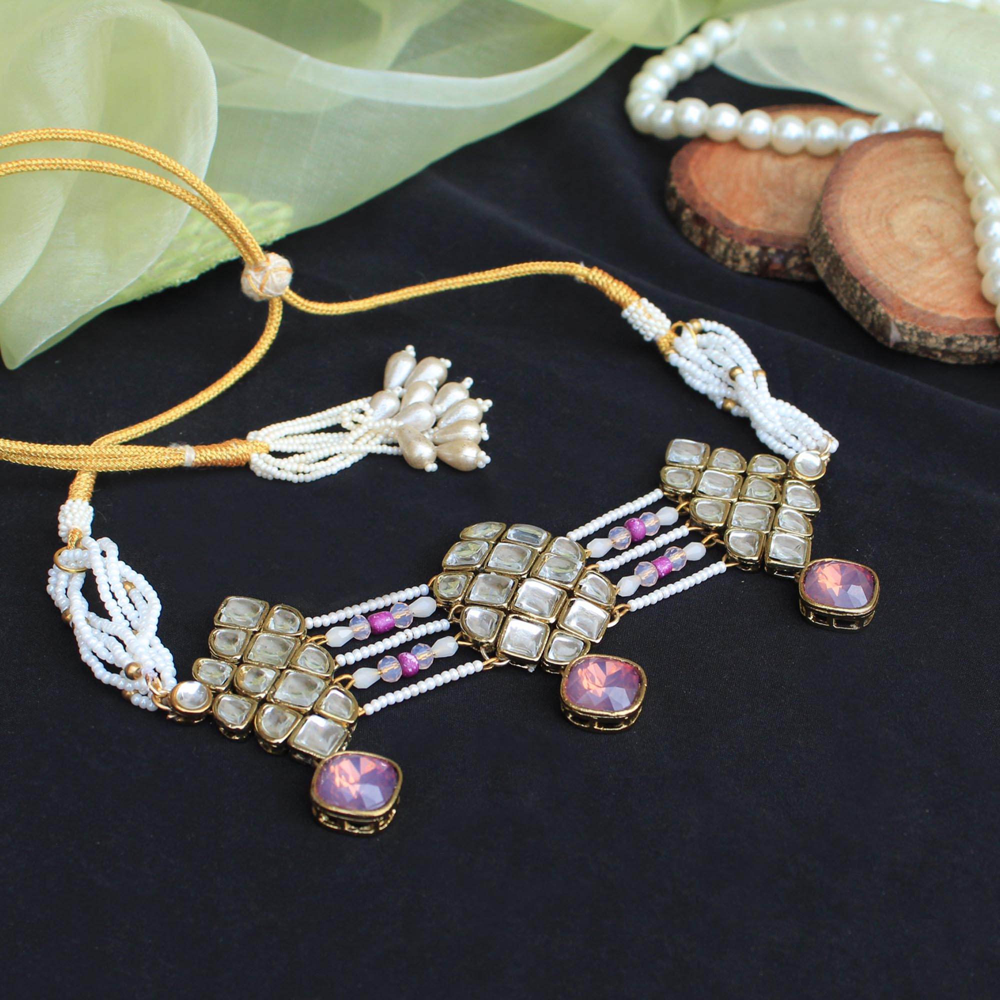 Kundan choker set in gold-tone with matching earrings and long bridal necklace, perfect for wedding functions , festive and bridal wear