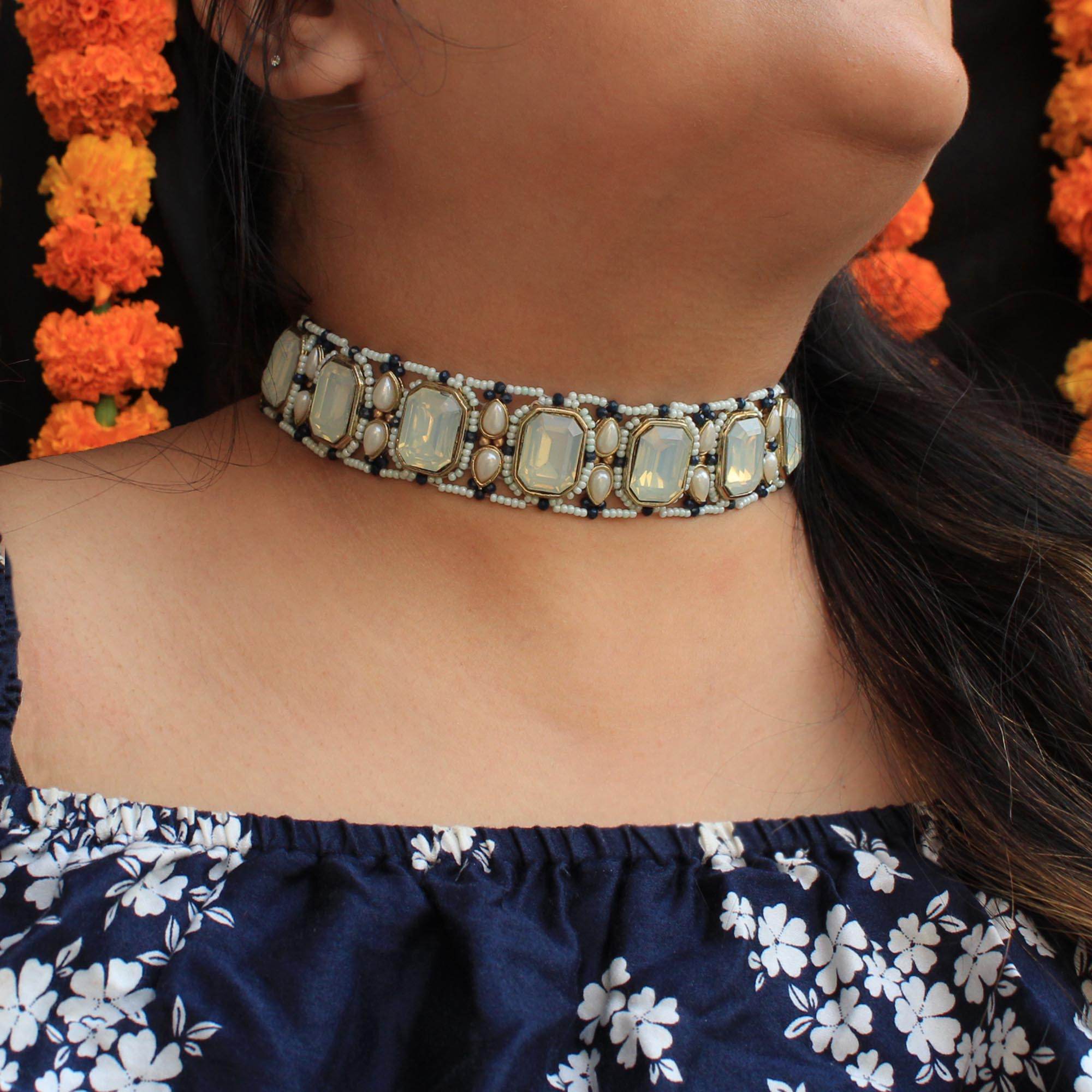 Kundan choker set in gold-tone with matching earrings and long bridal necklace, perfect for wedding functions , festive and bridal wear