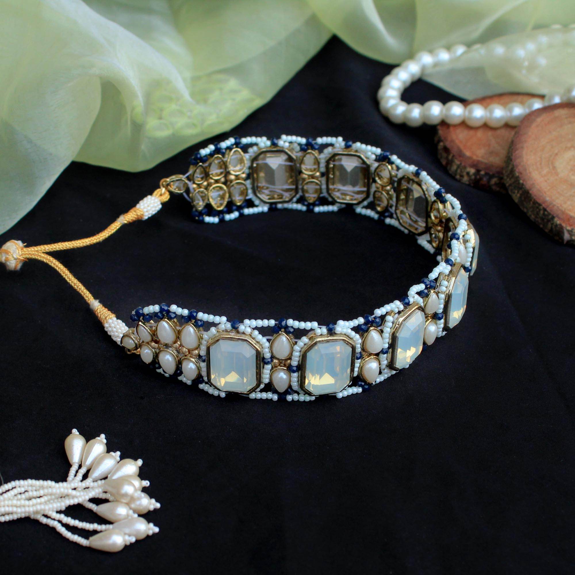 Kundan choker set in gold-tone with matching earrings and long bridal necklace, perfect for wedding functions , festive and bridal wear