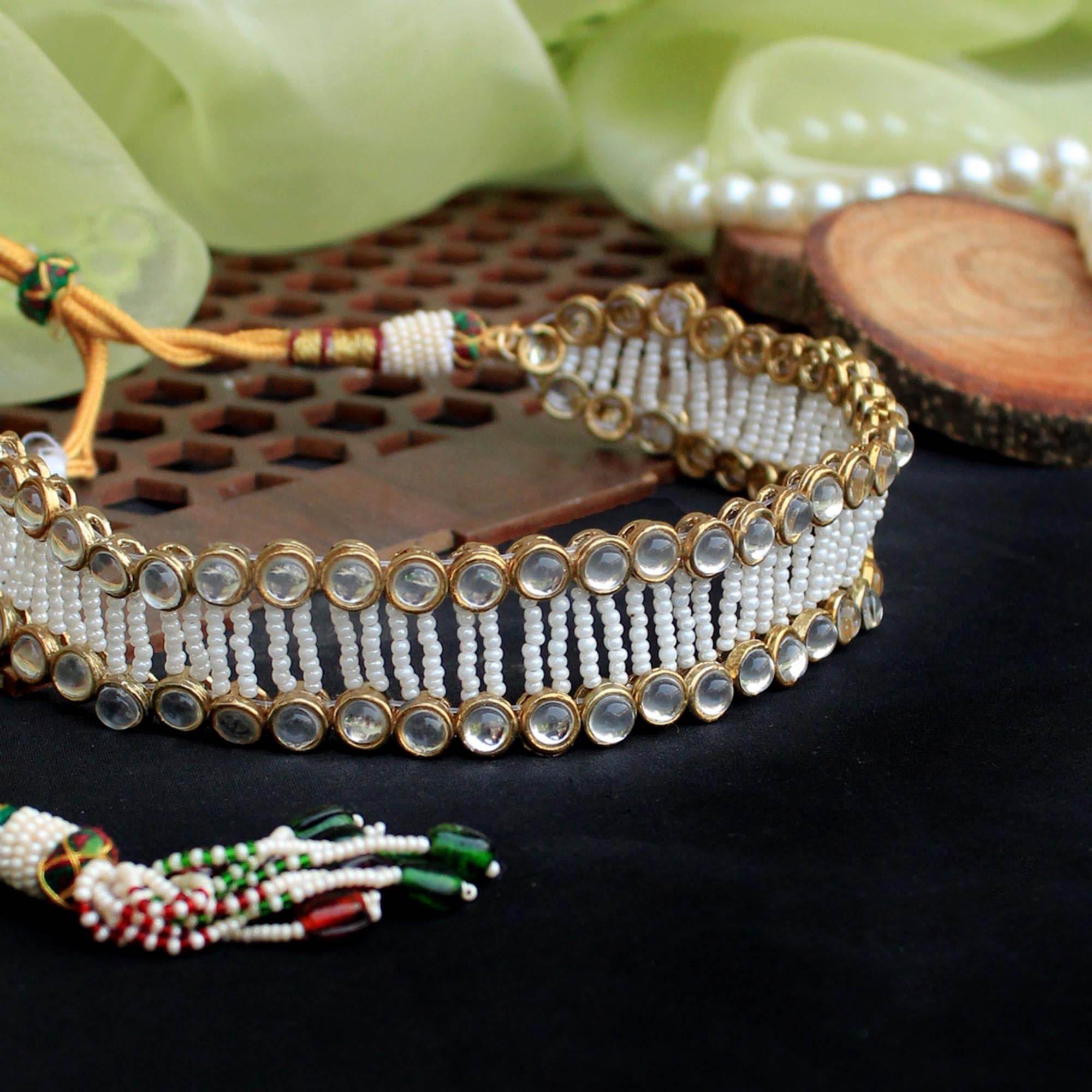Kundan choker set in gold-tone with matching earrings and long bridal necklace, perfect for wedding functions , festive and bridal wear