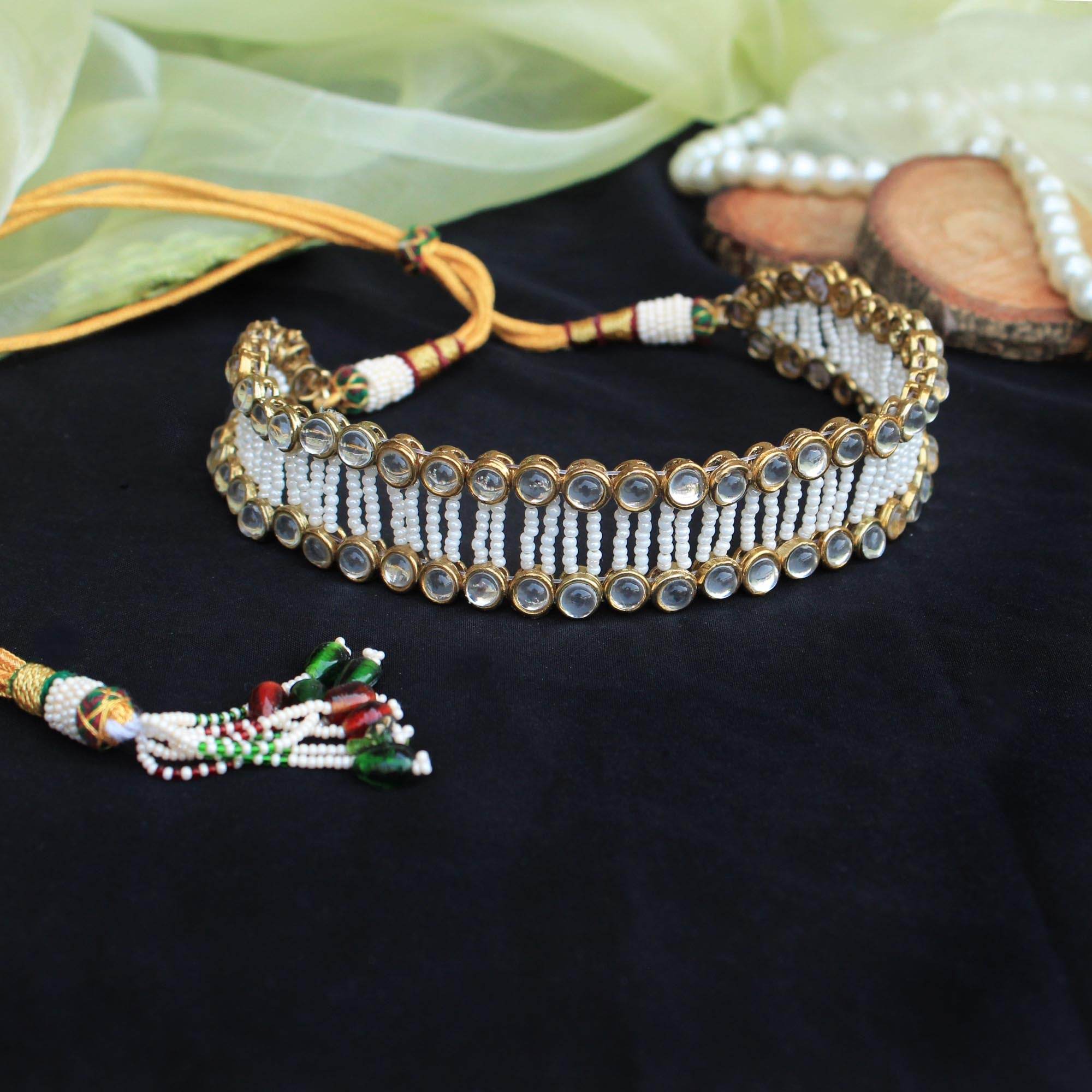 Kundan choker set in gold-tone with matching earrings and long bridal necklace, perfect for wedding functions , festive and bridal wear