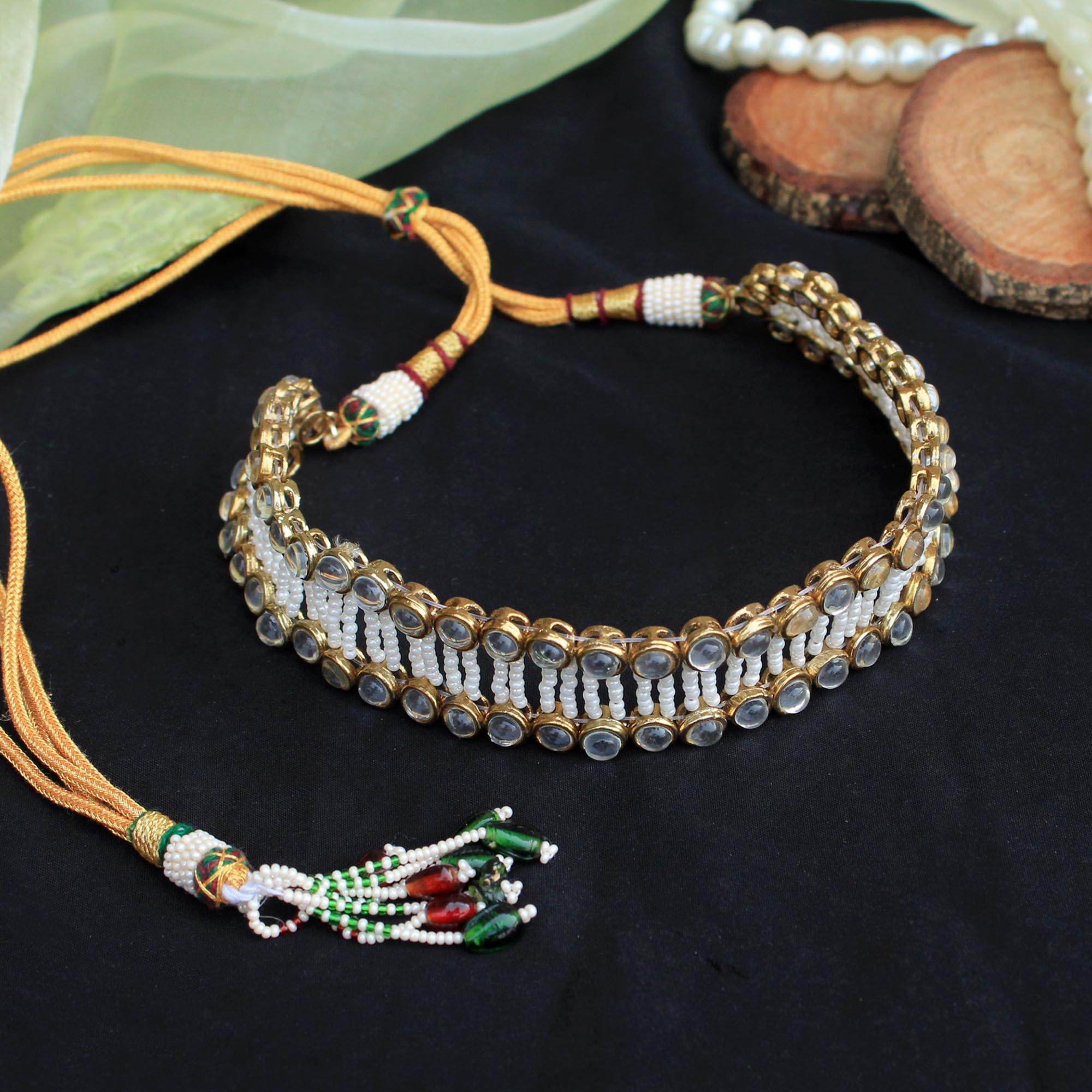 Kundan choker set in gold-tone with matching earrings and long bridal necklace, perfect for wedding functions , festive and bridal wear