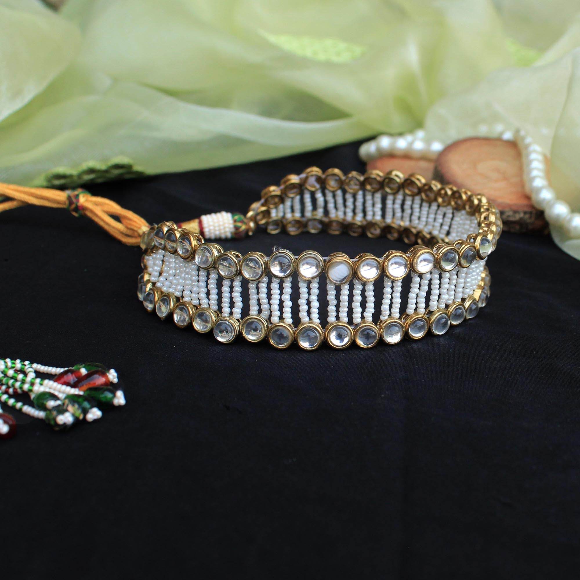 Kundan choker set in gold-tone with matching earrings and long bridal necklace, perfect for wedding functions , festive and bridal wear