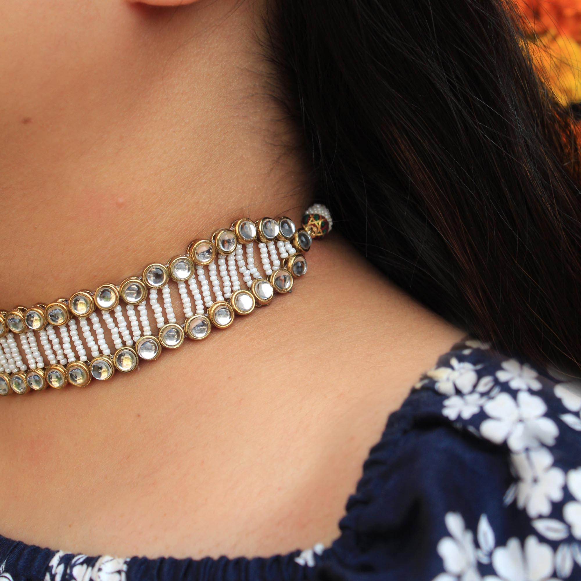Kundan choker set in gold-tone with matching earrings and long bridal necklace, perfect for wedding functions , festive and bridal wear