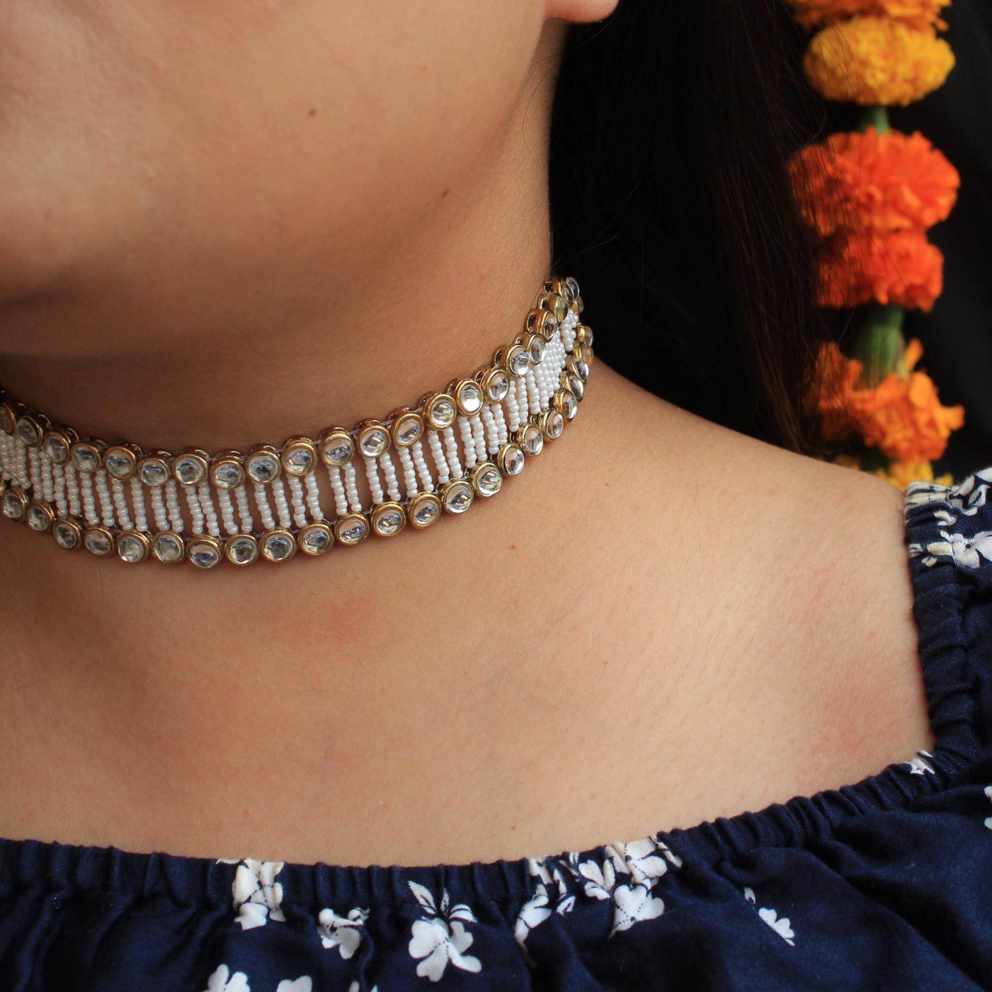 Kundan choker set in gold-tone with matching earrings and long bridal necklace, perfect for wedding functions , festive and bridal wear