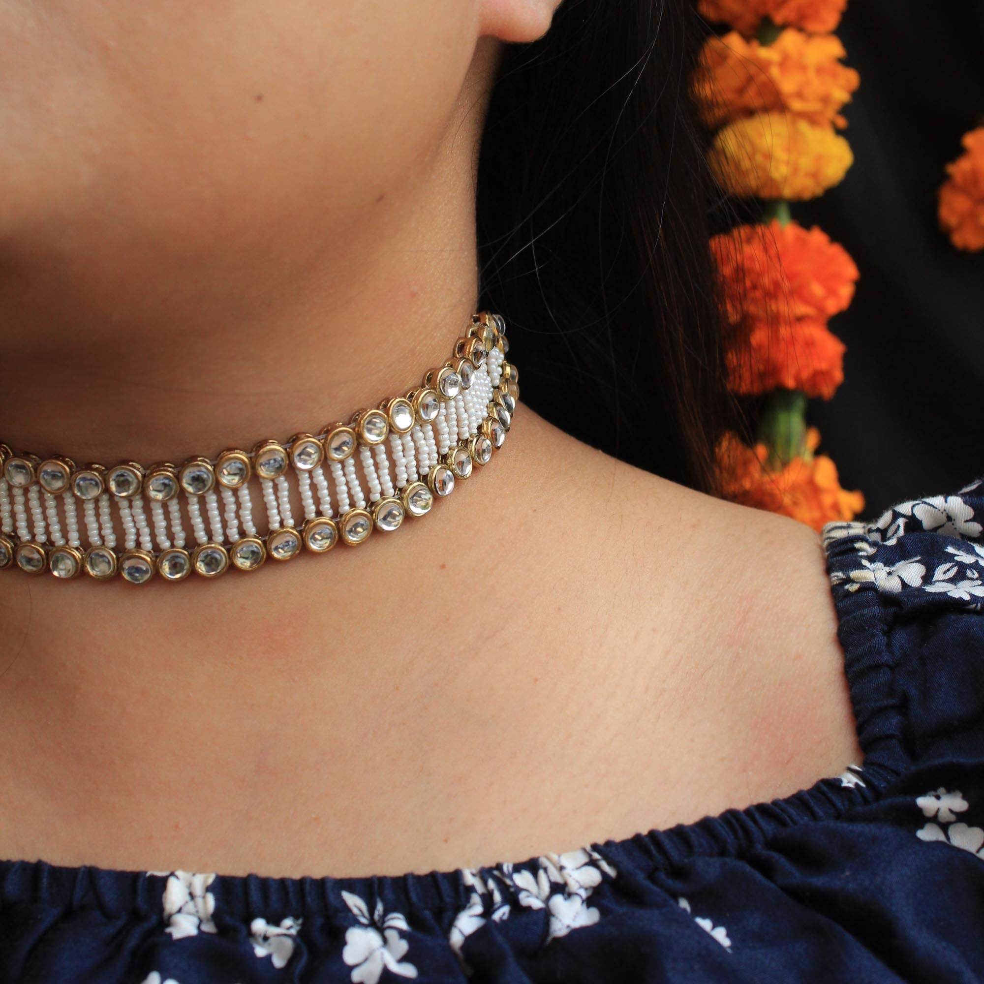Kundan choker set in gold-tone with matching earrings and long bridal necklace, perfect for wedding functions , festive and bridal wear