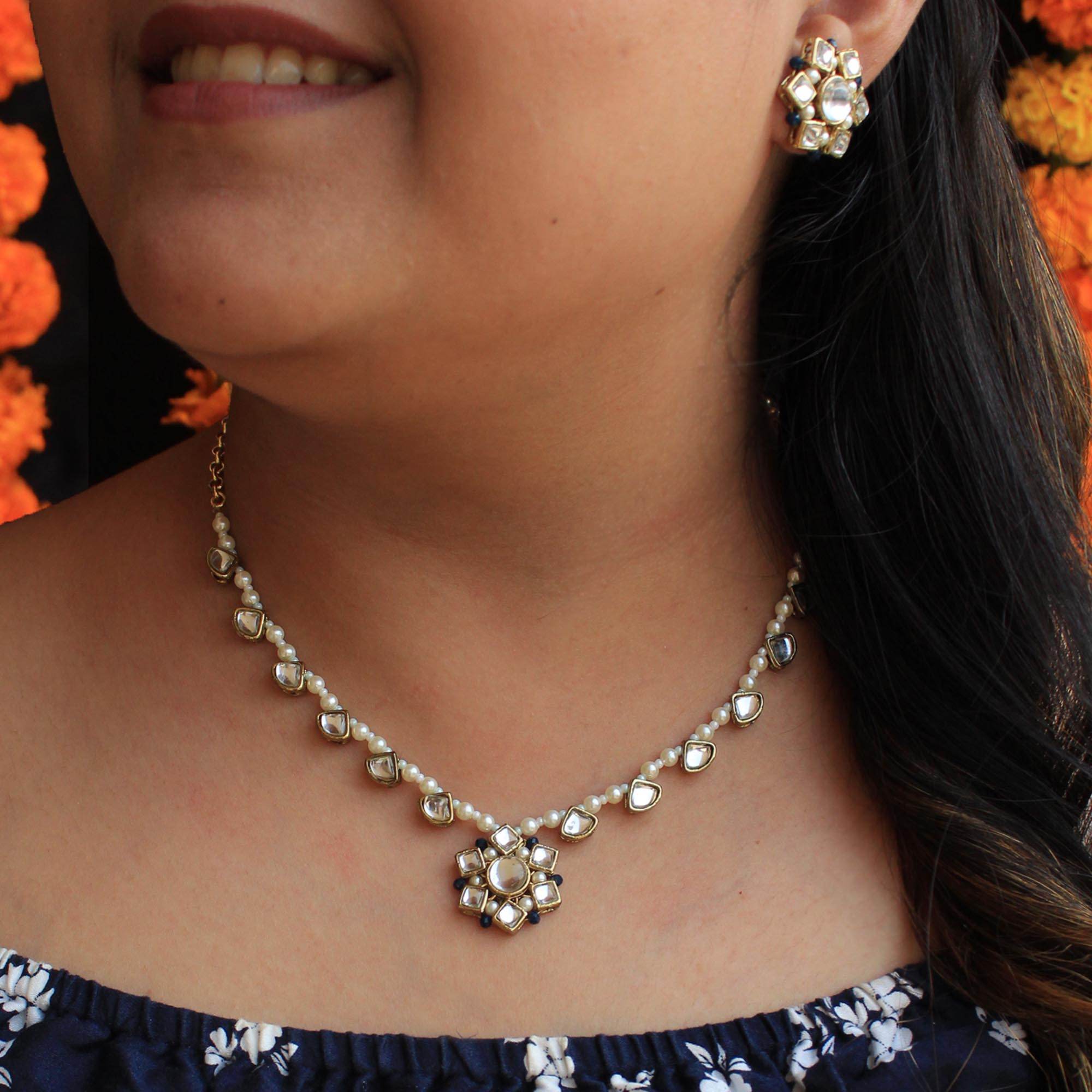 Kundan choker set in gold-tone with matching earrings and long bridal necklace, perfect for wedding functions , festive and bridal wear