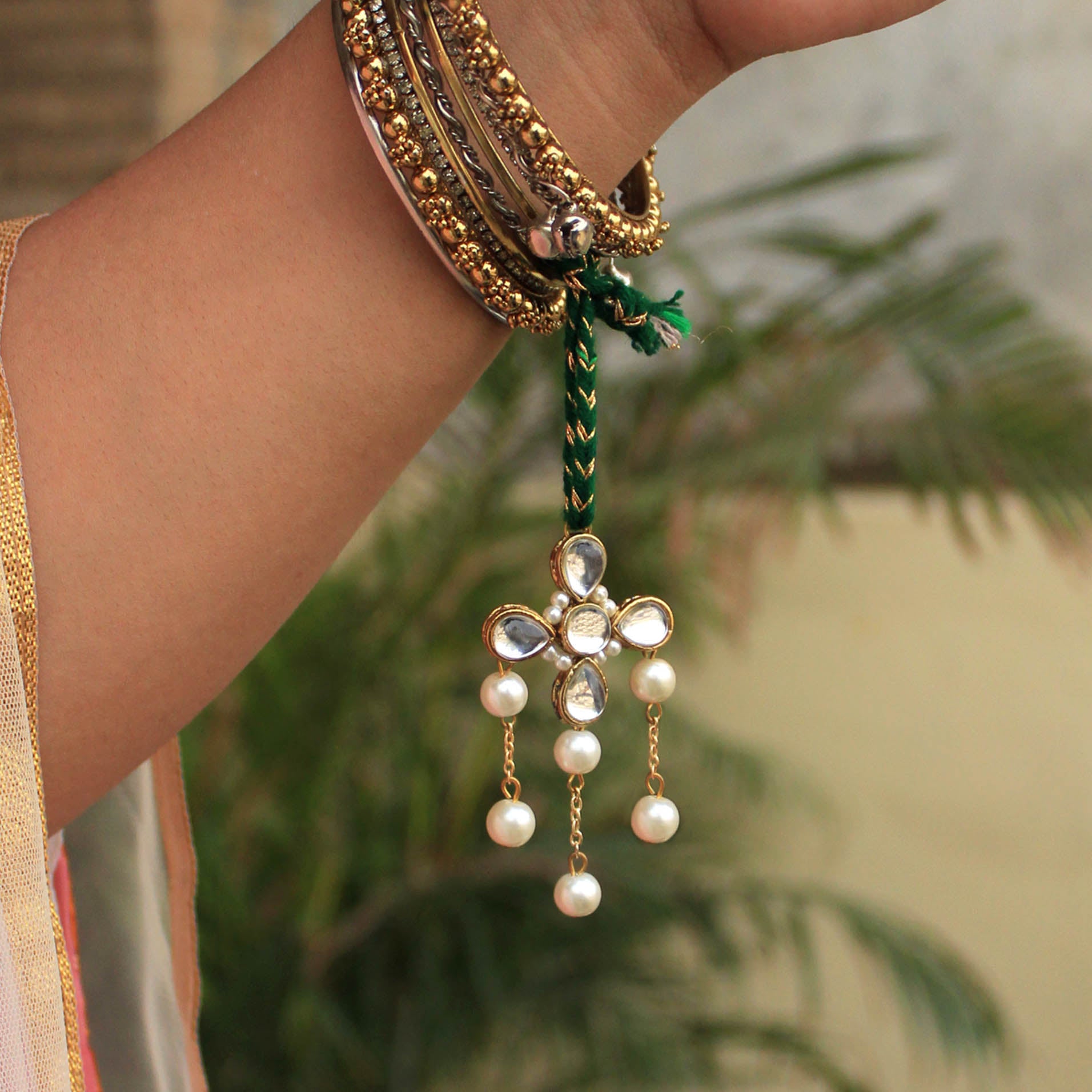 BeAbhika Kundan Gold Tone White Pearls Green Stone Bhabhi Lumba Rakhi For Sister In Law Sister Rakhi Designer Unique Bhabhi Rakhi Lumba Available In India Best Price Online Send Rakhi To Bhai Brother Hangin Lumba With Thread