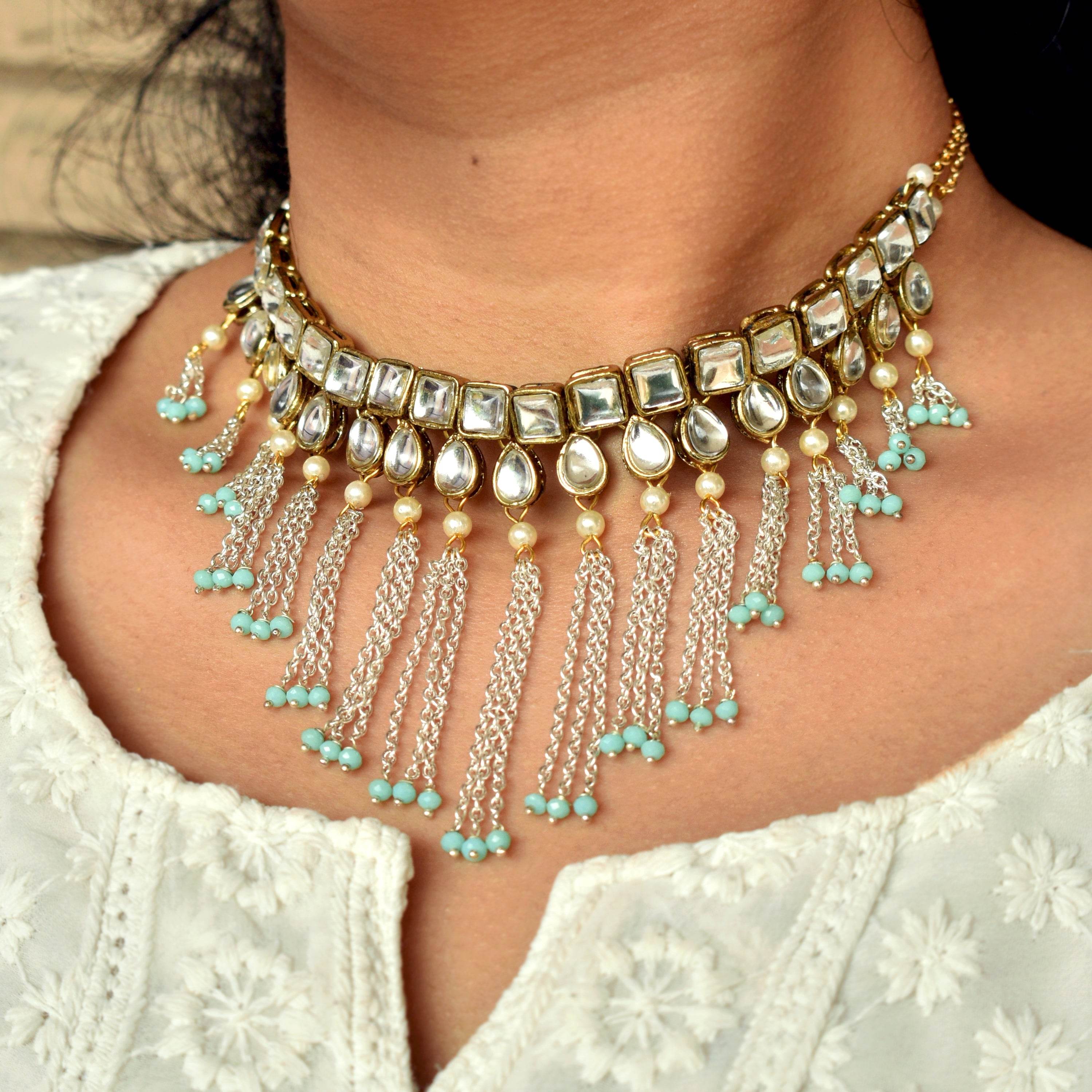 Kundan choker set in gold-tone with matching earrings and long bridal necklace, perfect for wedding functions , festive and bridal wear