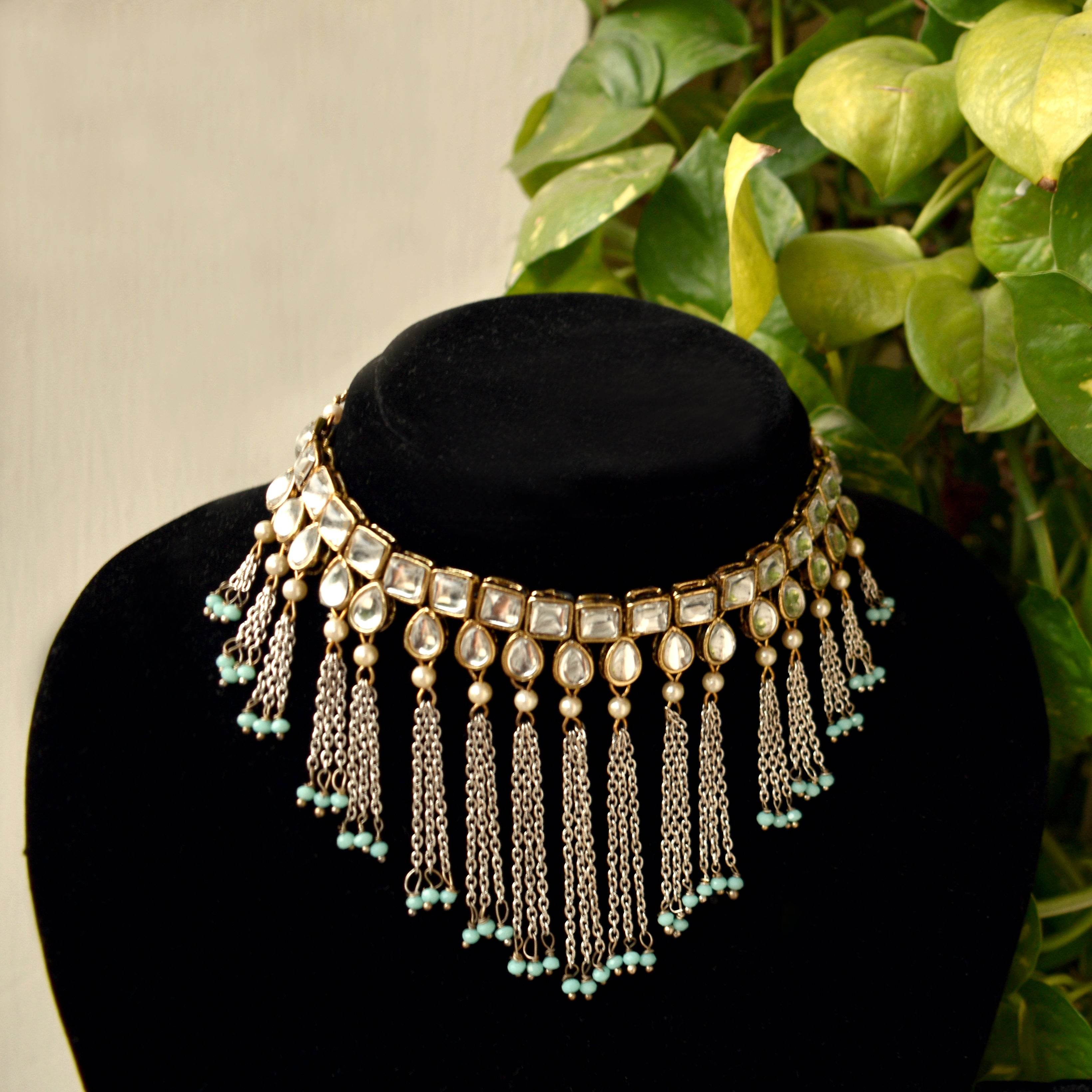 Kundan choker set in gold-tone with matching earrings and long bridal necklace, perfect for wedding functions , festive and bridal wear