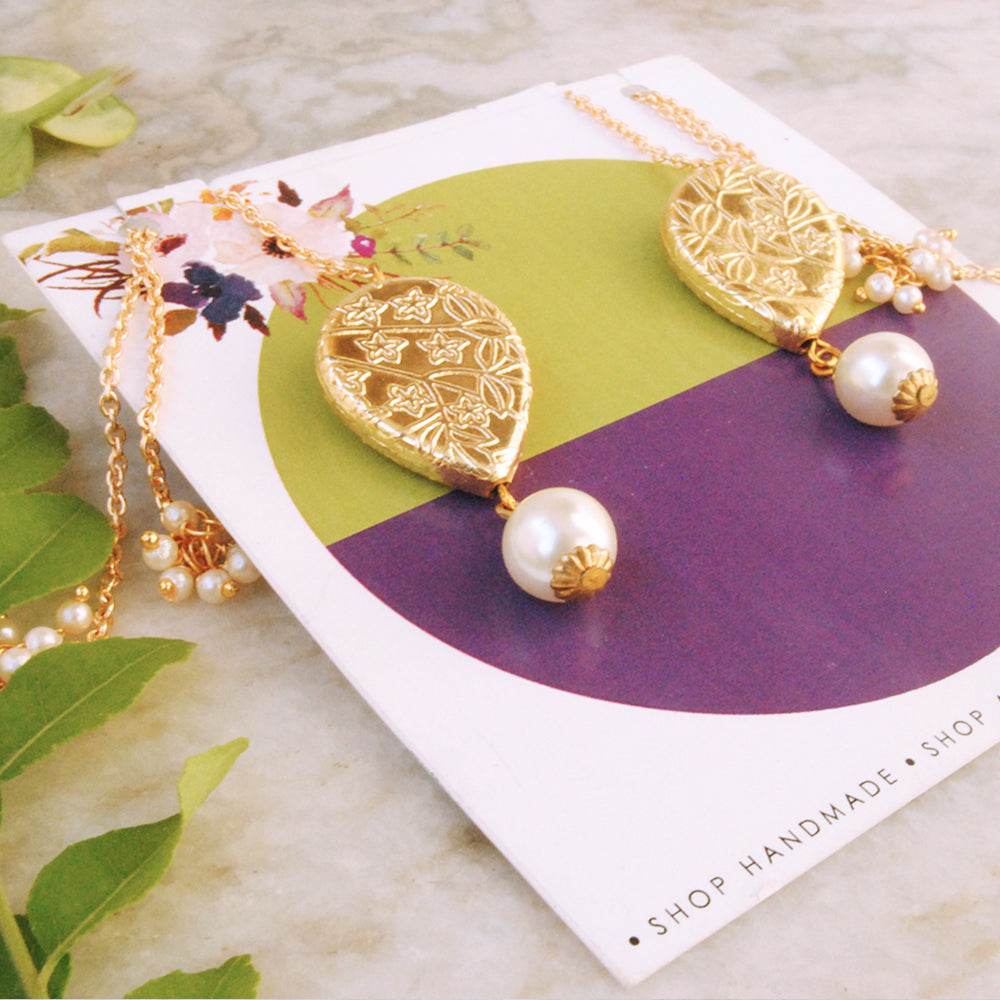 Traditional Kundan earrings in gold-tone, perfect for weddings and festive wear