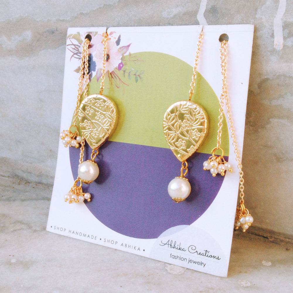 Traditional Kundan earrings in gold-tone, perfect for weddings and festive wear