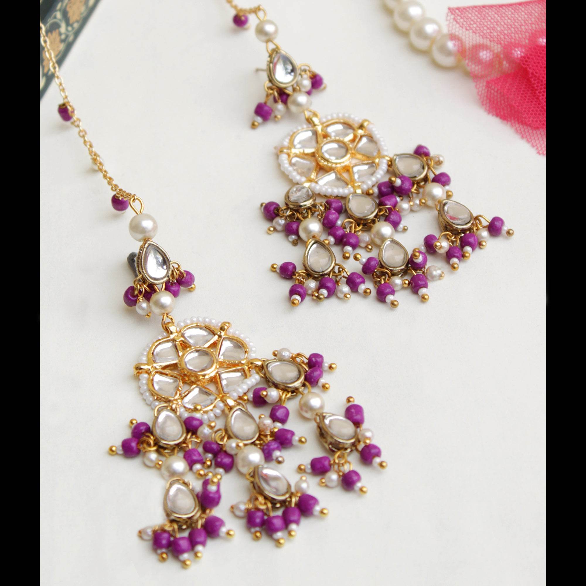 Traditional Kundan earrings in gold-tone, perfect for weddings and festive wear