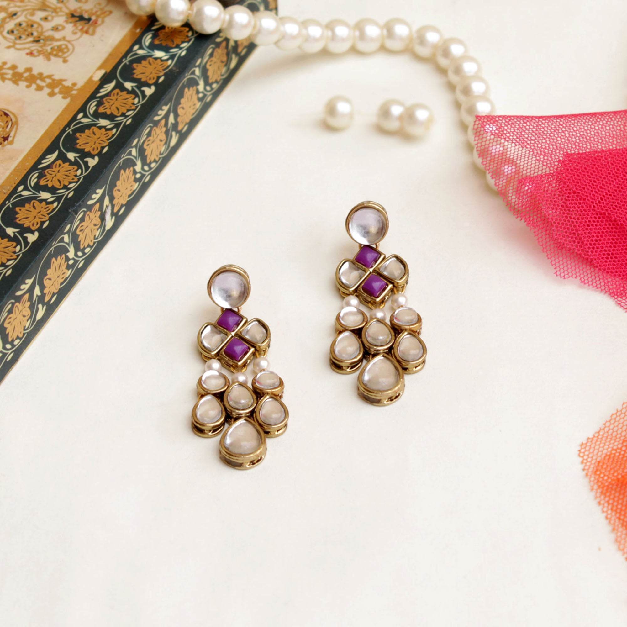 Traditional Kundan earrings in gold-tone, perfect for weddings and festive wear