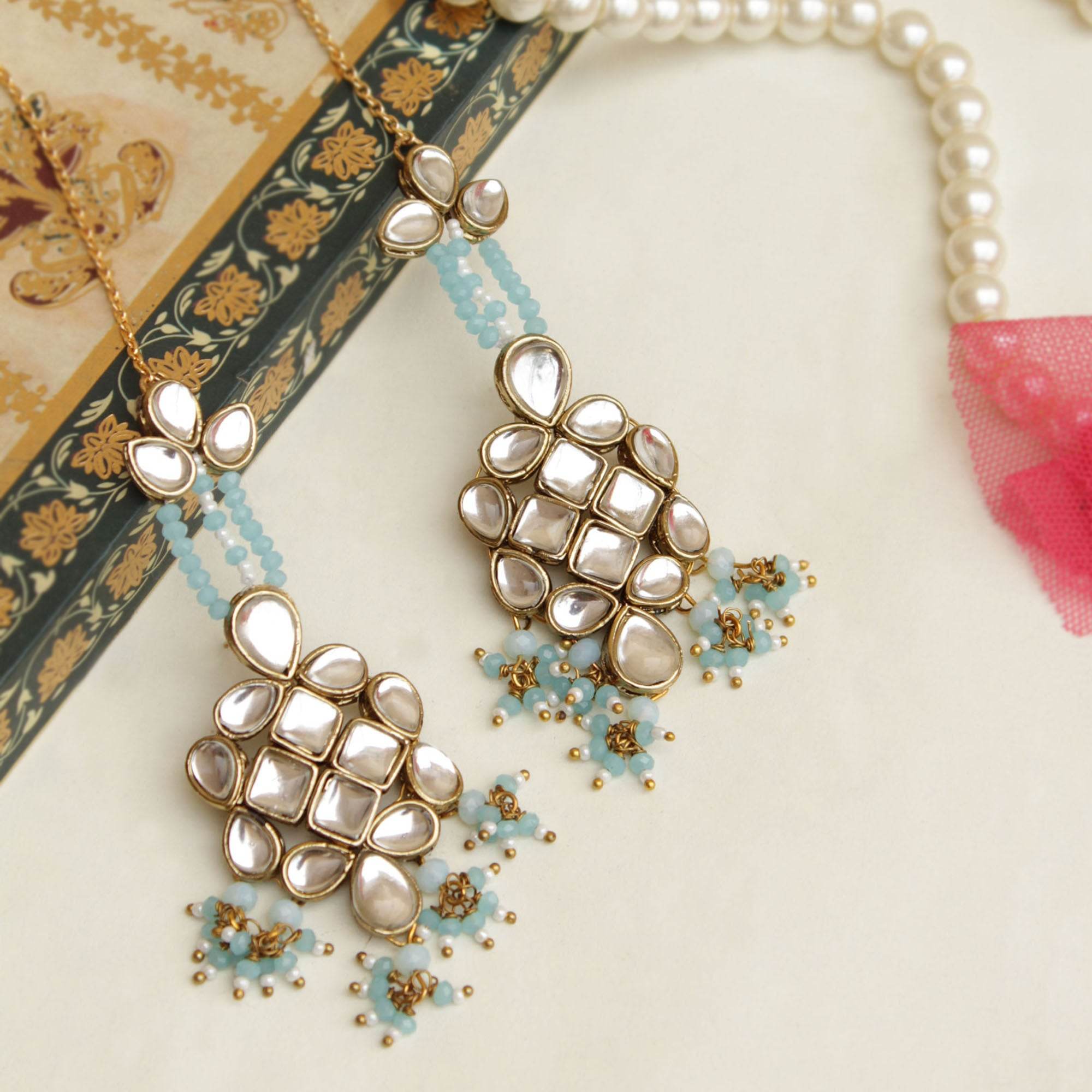 Traditional Kundan earrings in gold-tone, perfect for weddings and festive wear