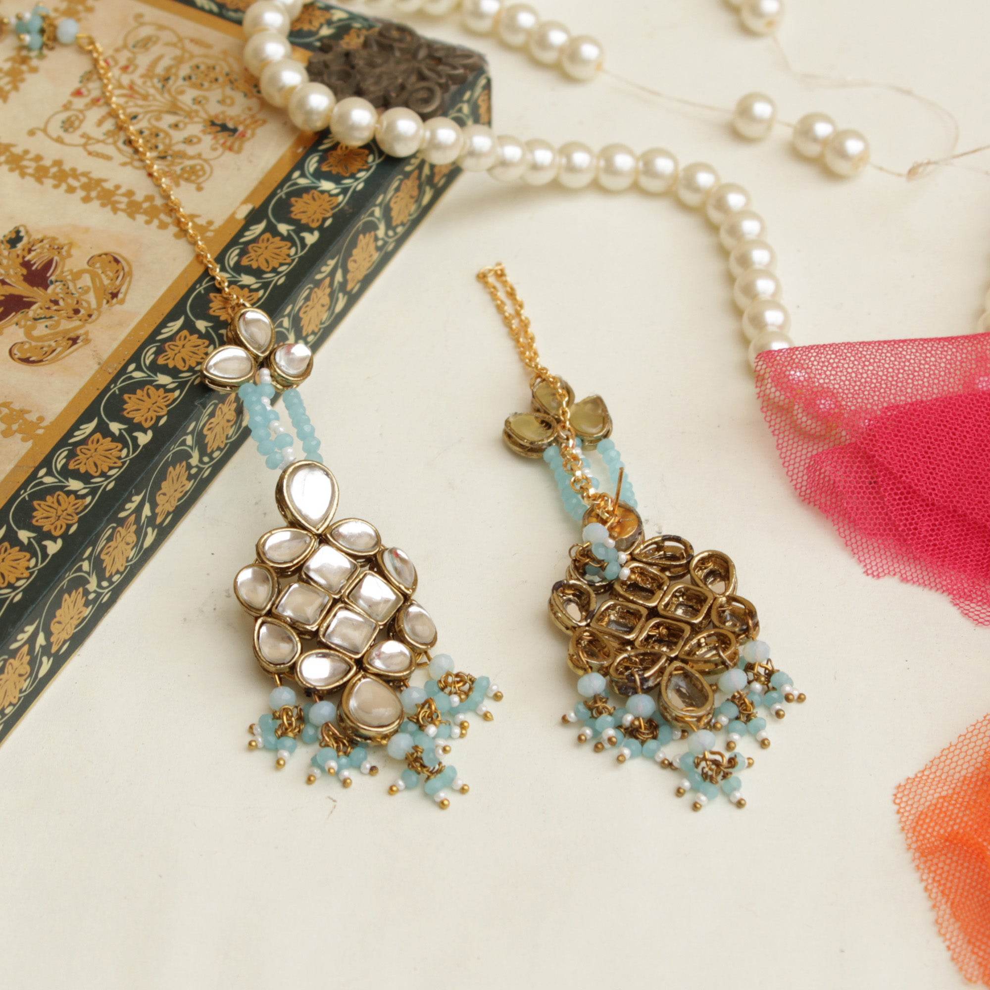 Traditional Kundan earrings in gold-tone, perfect for weddings and festive wear