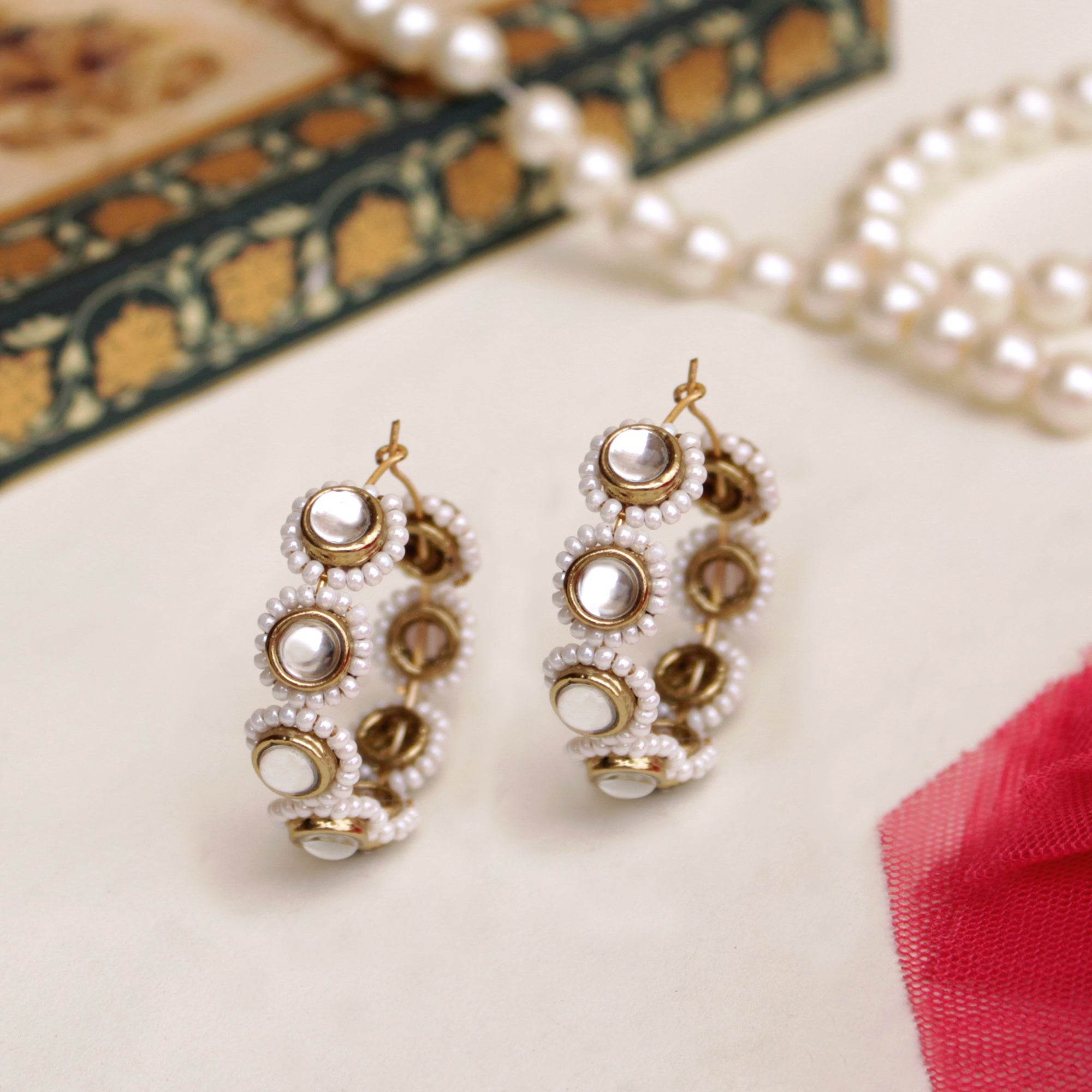 Traditional Kundan earrings in gold-tone, perfect for weddings and festive wear