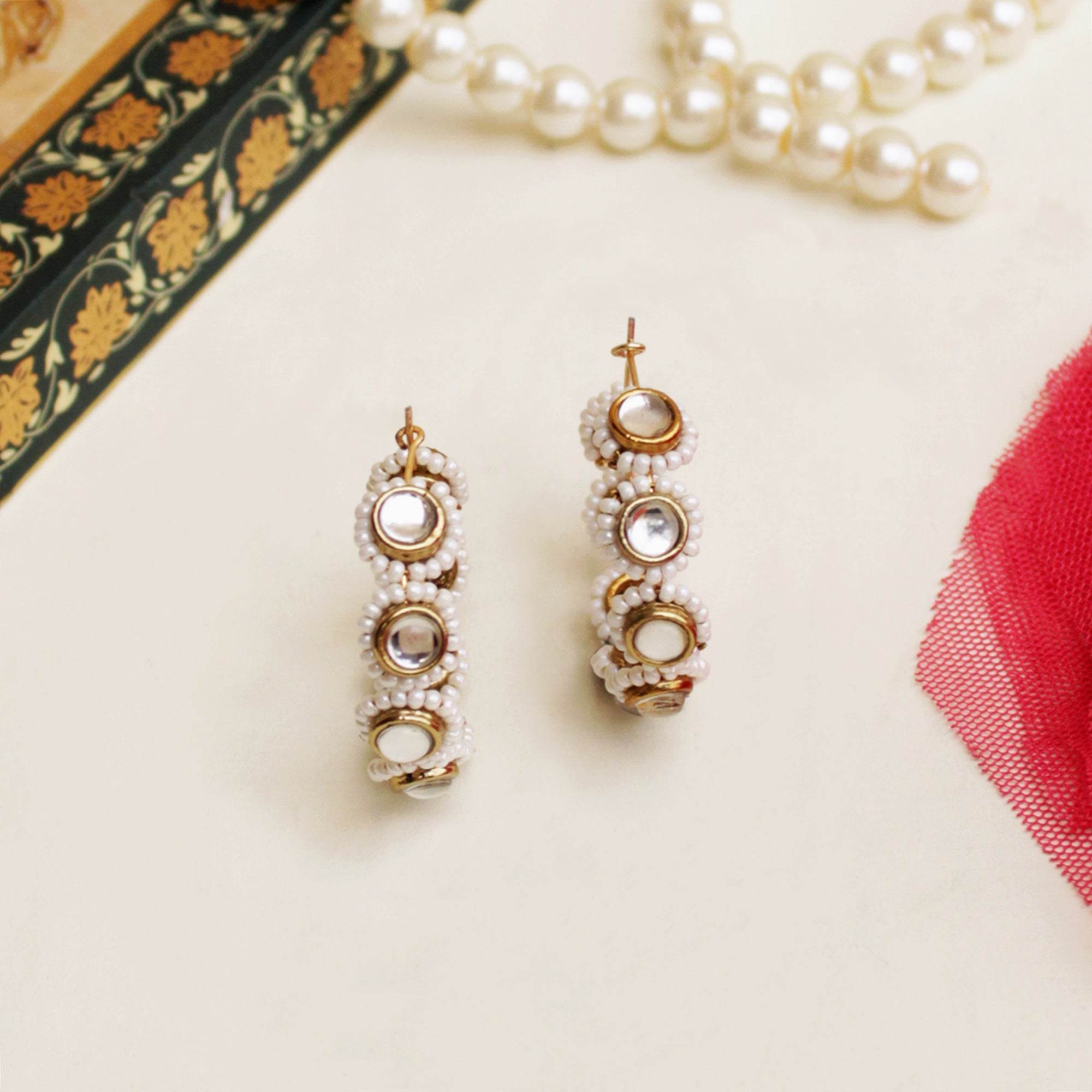 Traditional Kundan earrings in gold-tone, perfect for weddings and festive wear