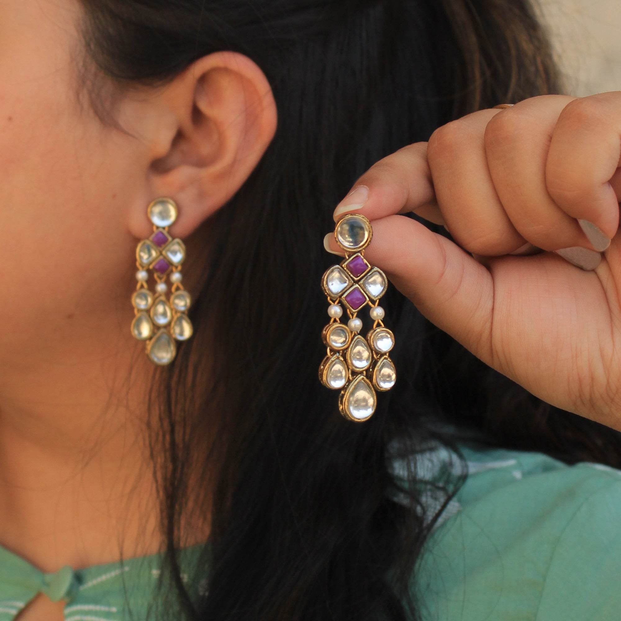 Traditional Kundan earrings in gold-tone, perfect for weddings and festive wear