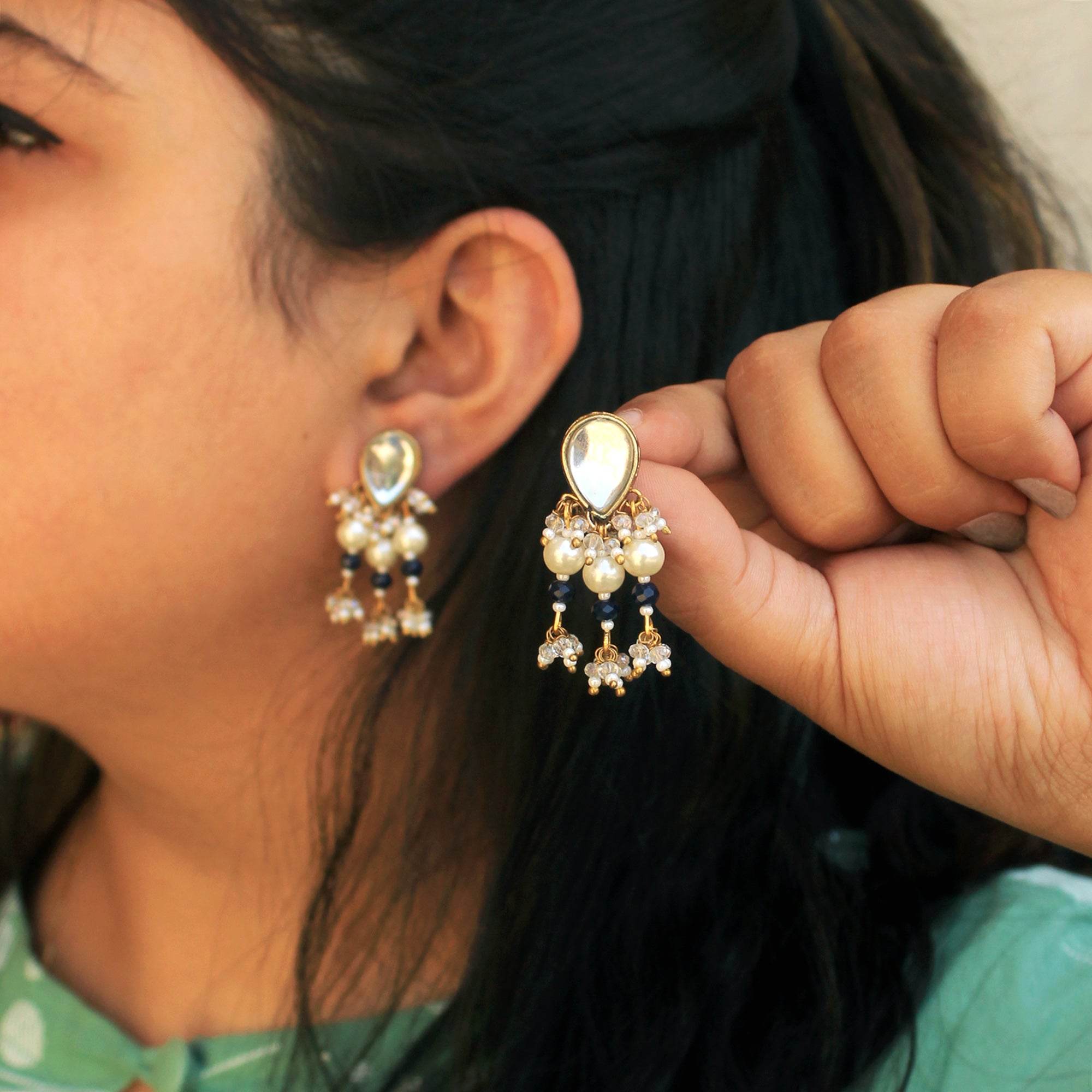 Traditional Kundan earrings in gold-tone, perfect for weddings and festive wear