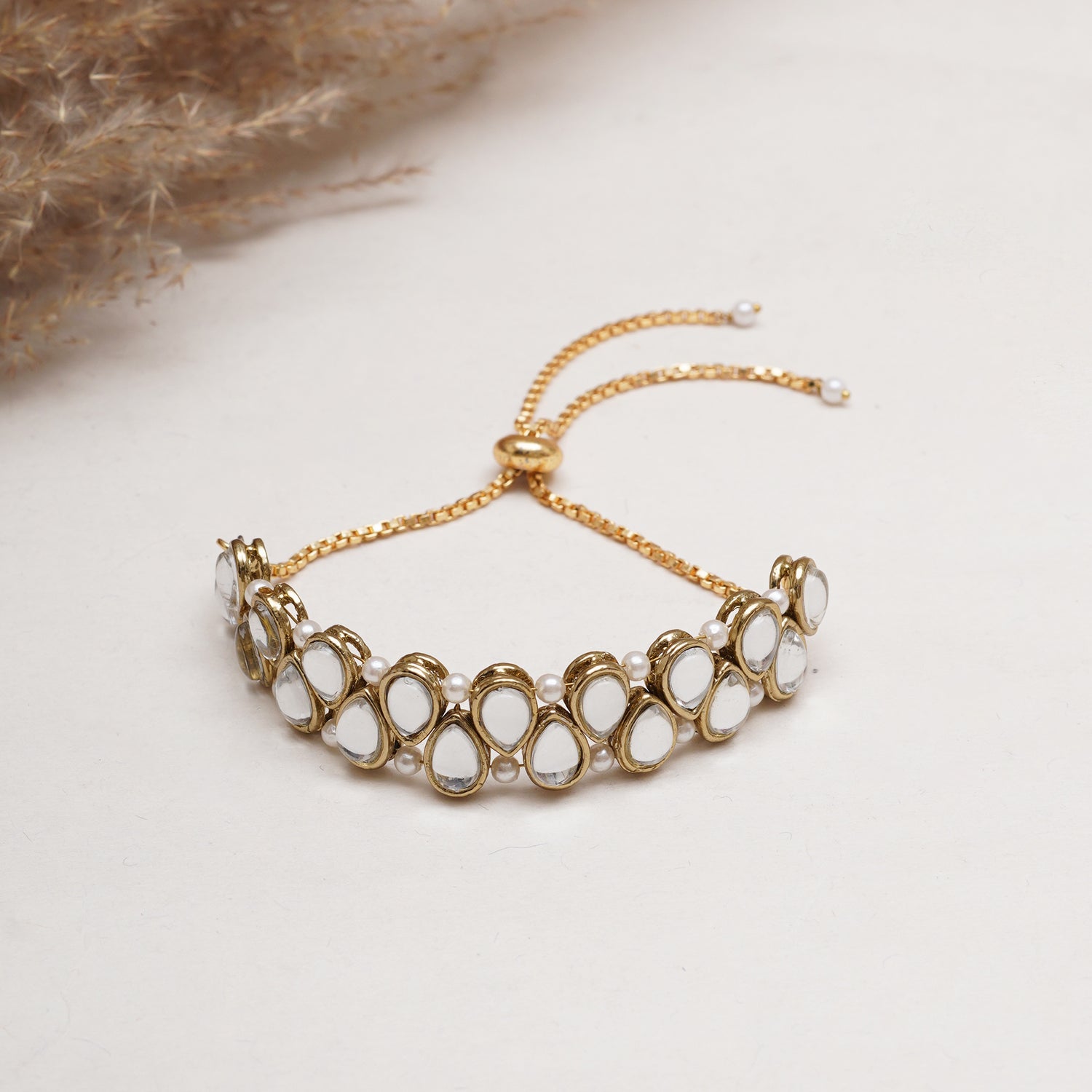 Golden Double Layer Tilak Kundan With White Pearls Adjustable Bracelet